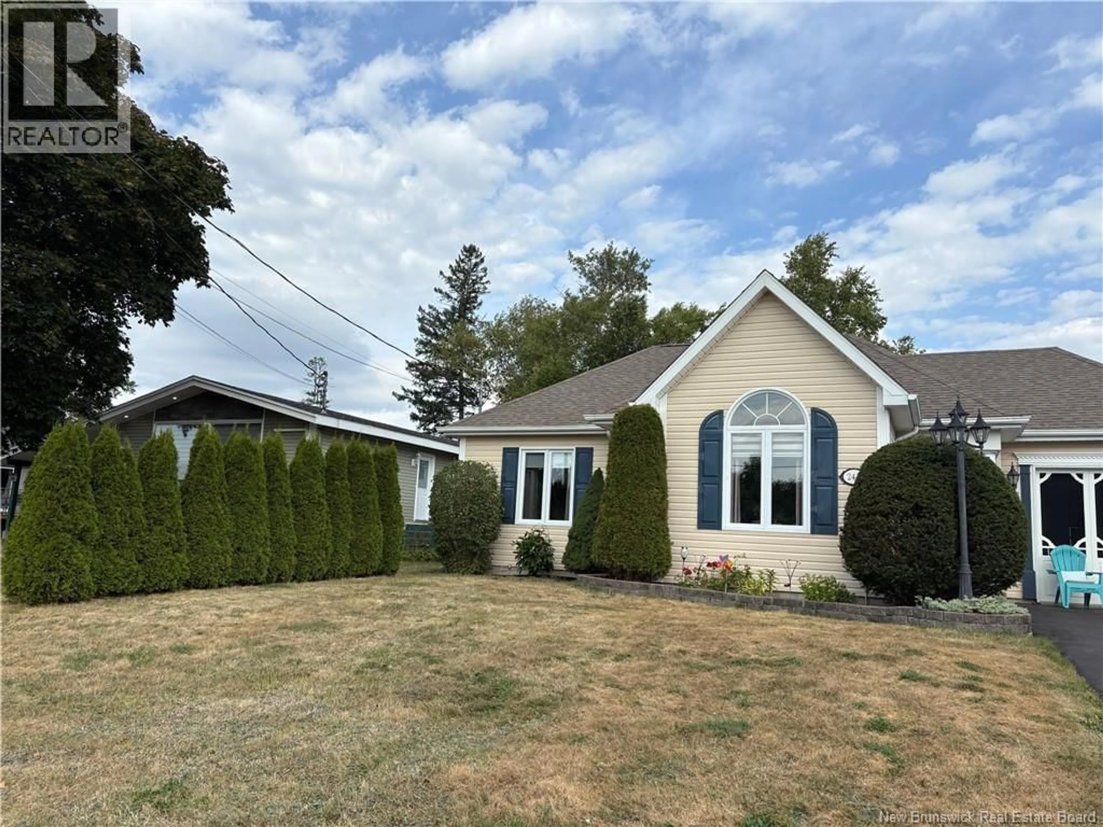 Home with vinyl exterior material, street for 244 MARIE STREET, Beresford New Brunswick E8K1P8