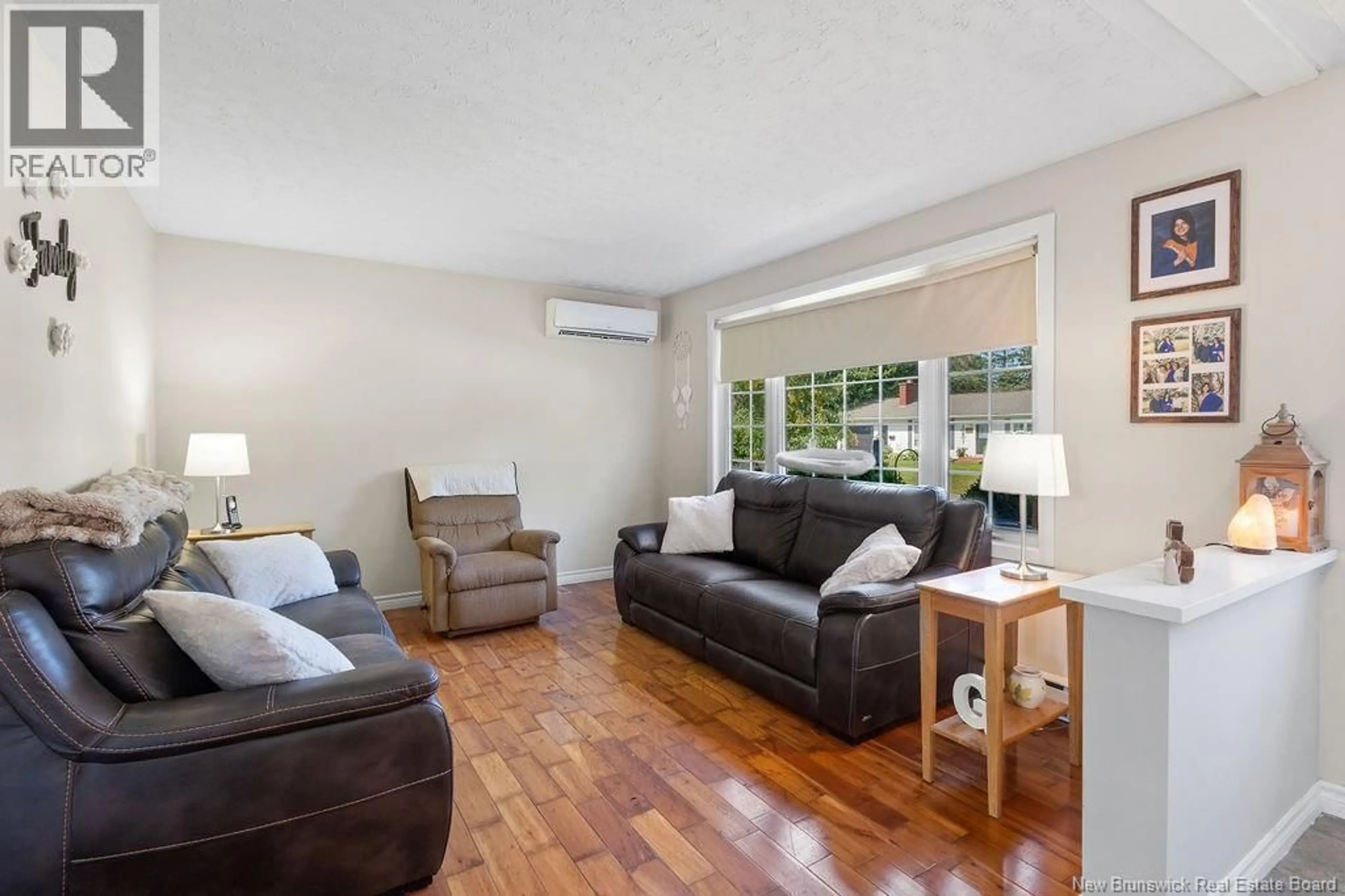 Living room with furniture, wood/laminate floor for 503 MACMILLAN DRIVE, Miramichi New Brunswick E1V3R8