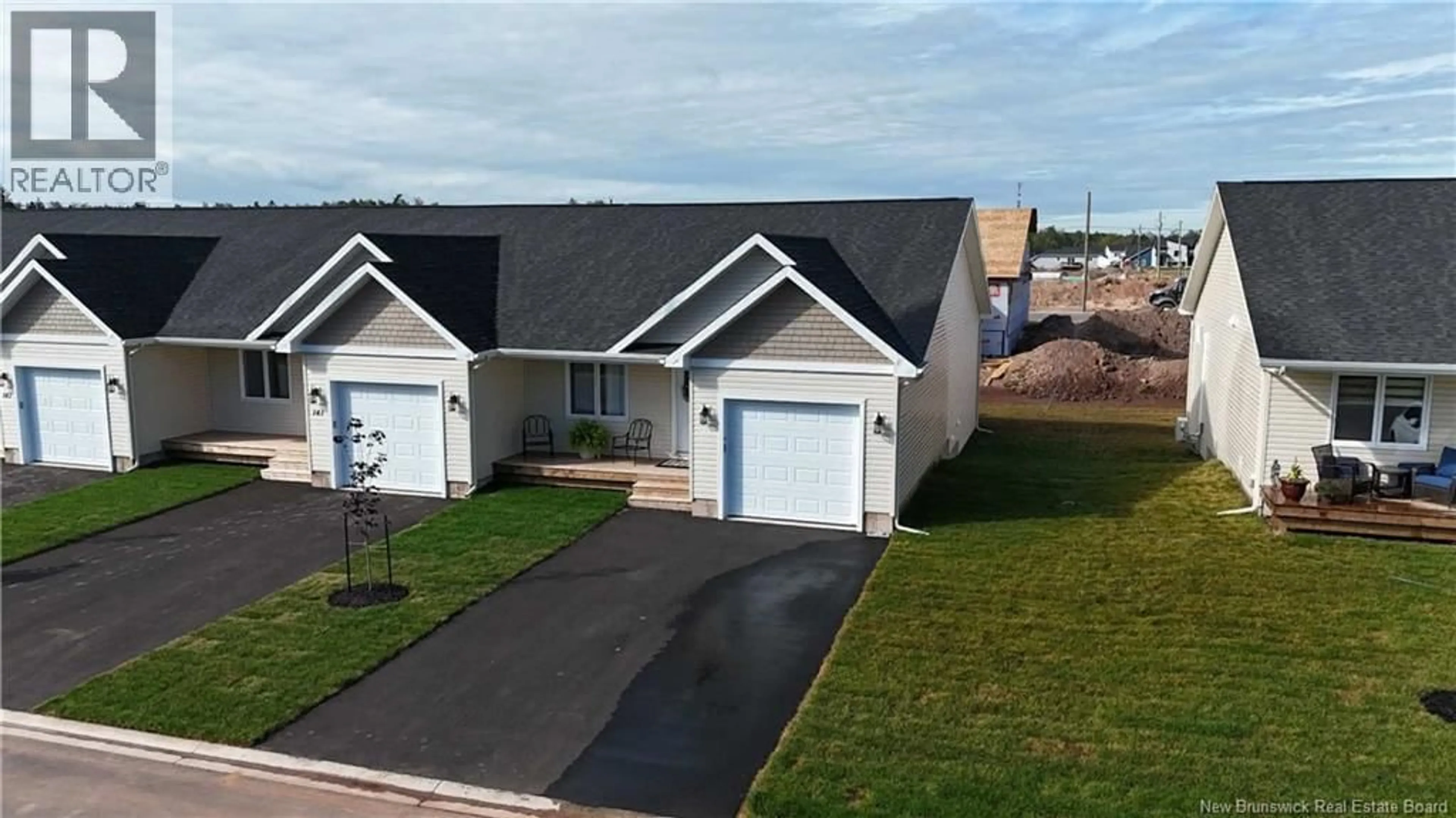 A pic from outside/outdoor area/front of a property/back of a property/a pic from drone, street for 211 SIMONE GALLANT CRESCENT, Shediac New Brunswick E4P2B7