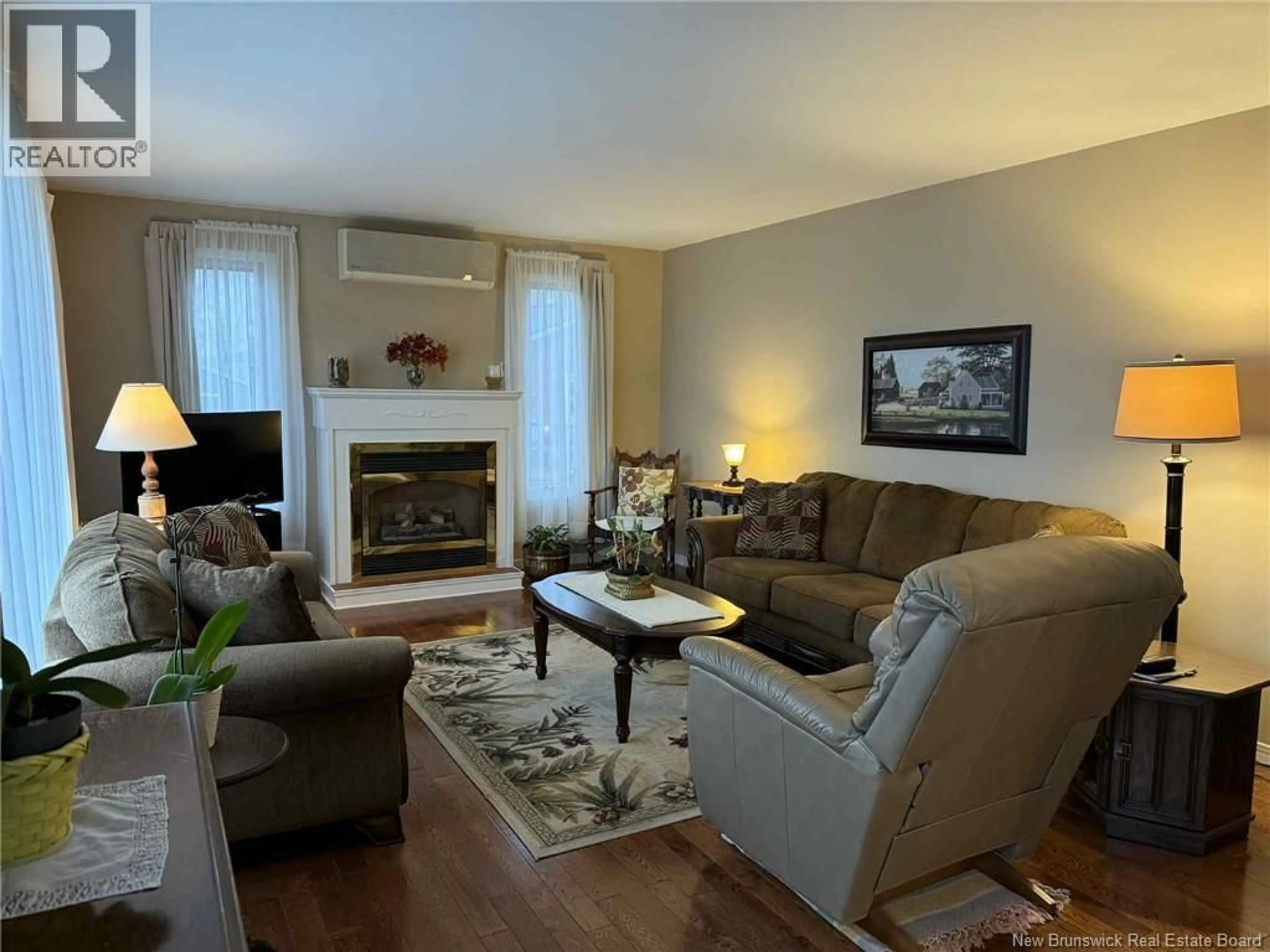 Living room with furniture, wood/laminate floor for 13 BRAMALEA AVENUE, Miramichi New Brunswick E1N1Z8