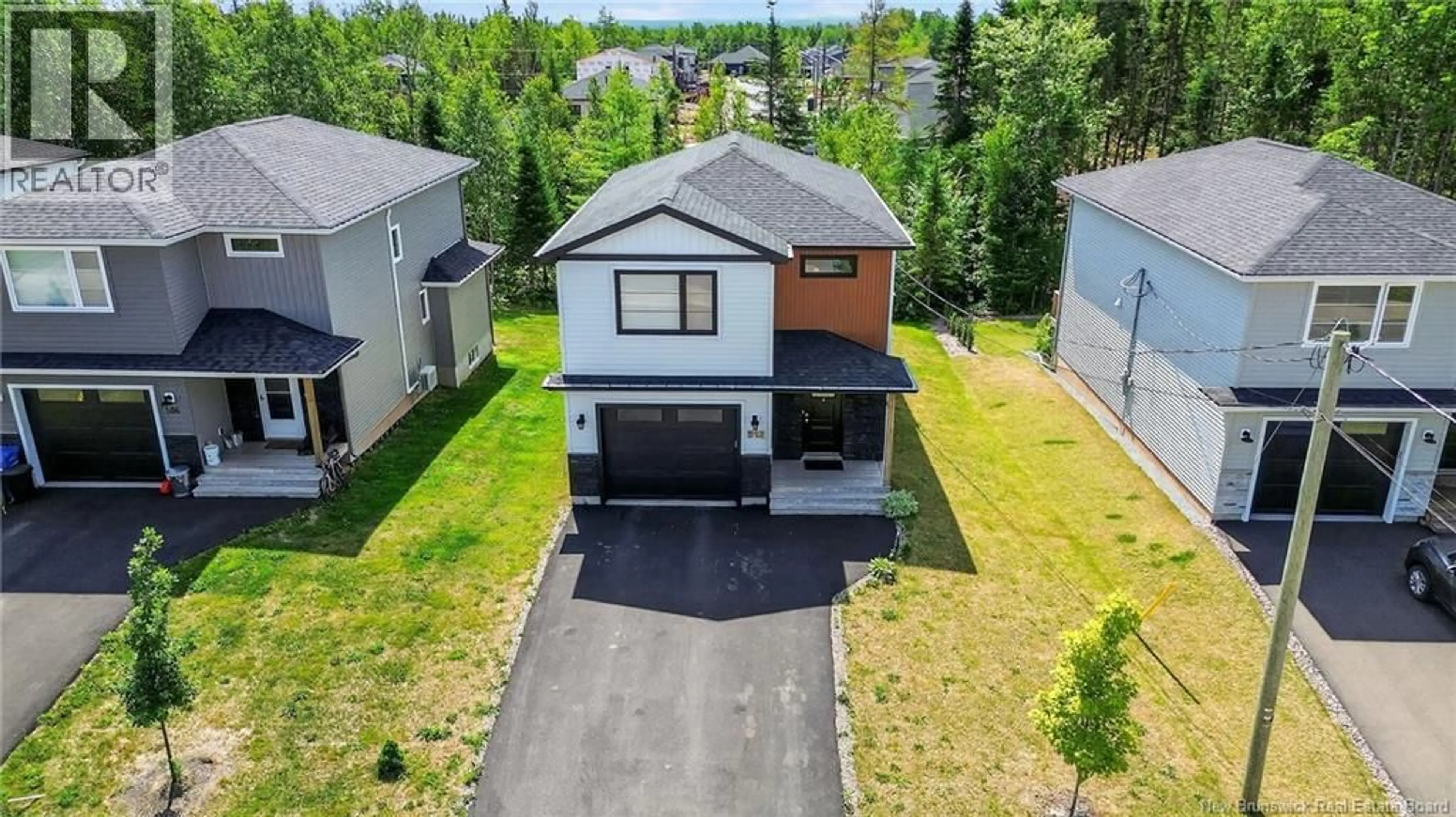 A pic from outside/outdoor area/front of a property/back of a property/a pic from drone, street for 512 MAPLEHURST DRIVE, Moncton New Brunswick E1G6E2