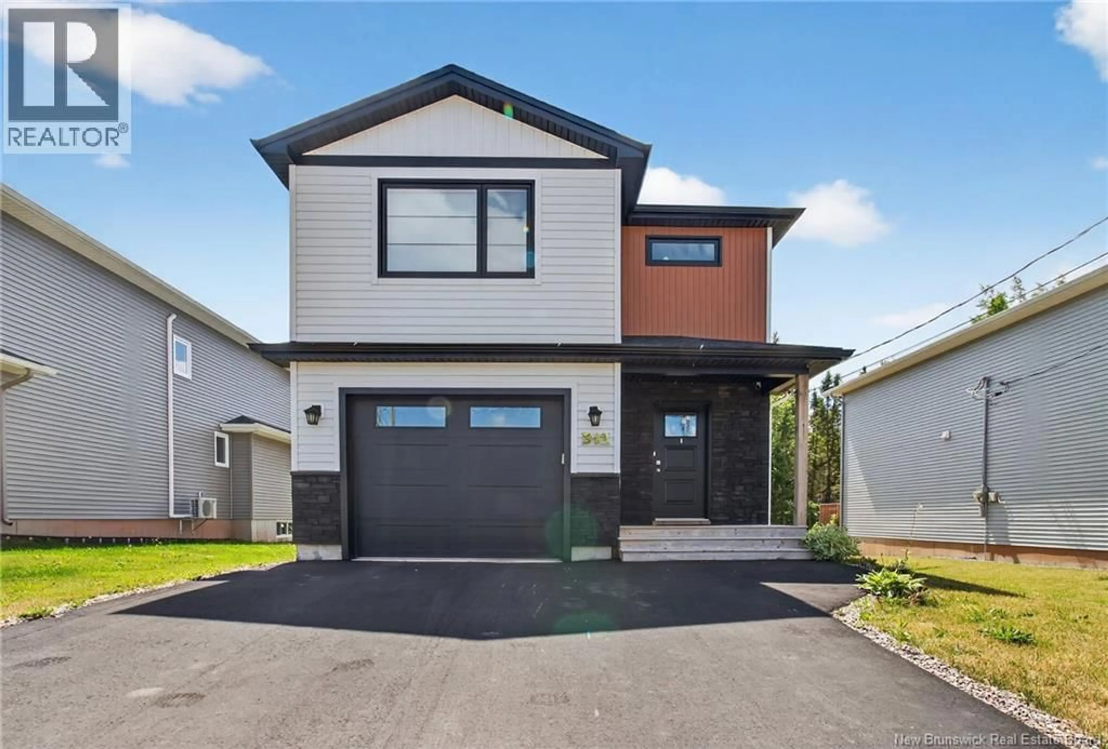 Home with vinyl exterior material, street for 512 MAPLEHURST DRIVE, Moncton New Brunswick E1G6E2