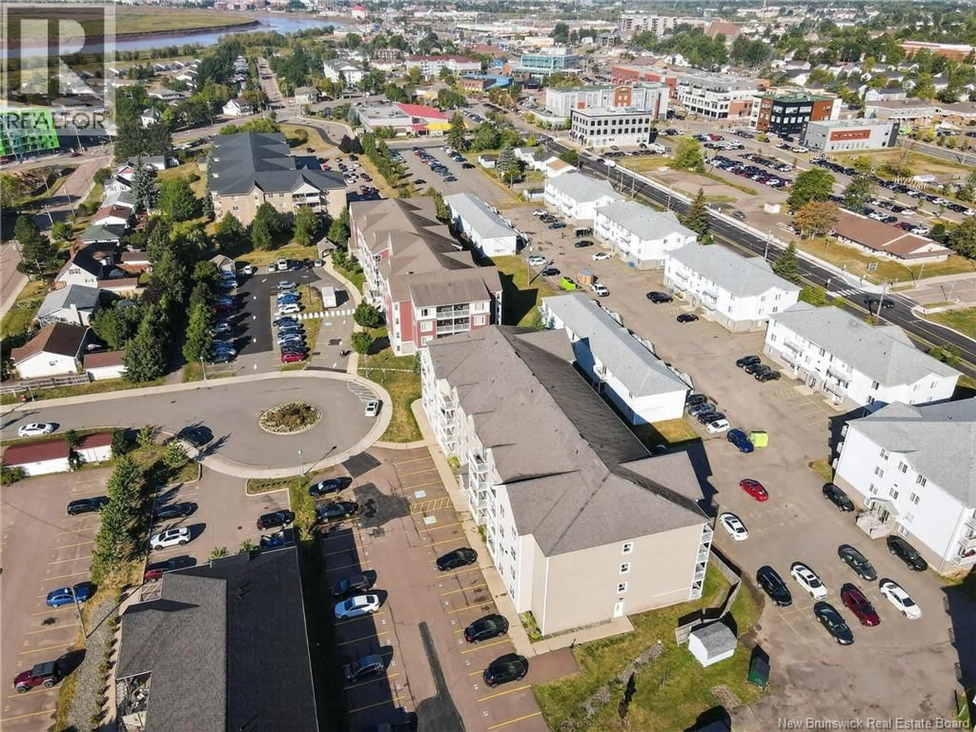 A pic from outside/outdoor area/front of a property/back of a property/a pic from drone, street for 203 - 33 SIFROI STREET, Dieppe New Brunswick E1A1L6