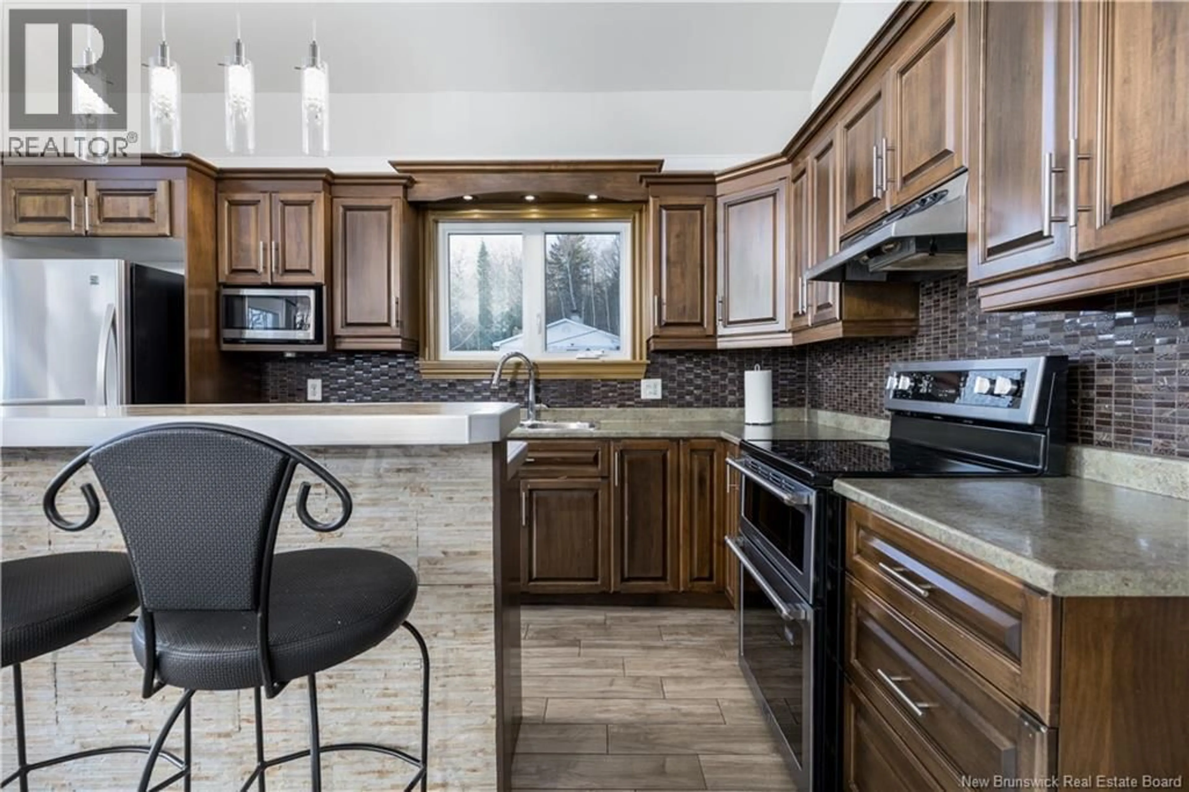 Open concept kitchen, ceramic/tile floor for 646 DAVIS STREET, Grand-Sault/Grand Falls New Brunswick E3Z1B8