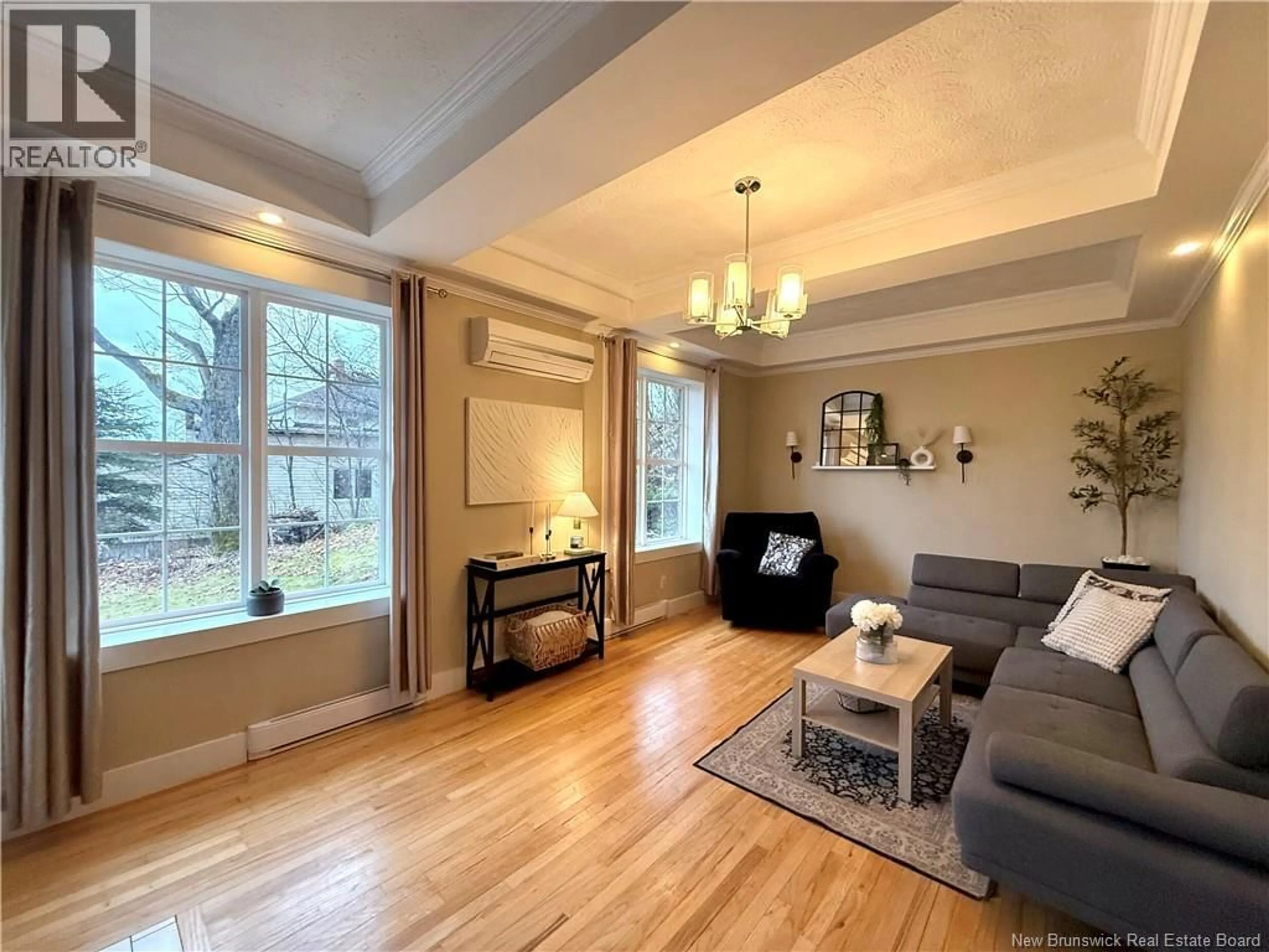 Living room with furniture, wood/laminate floor for 8 CONWAY STREET, Edmundston New Brunswick E3V1Z1