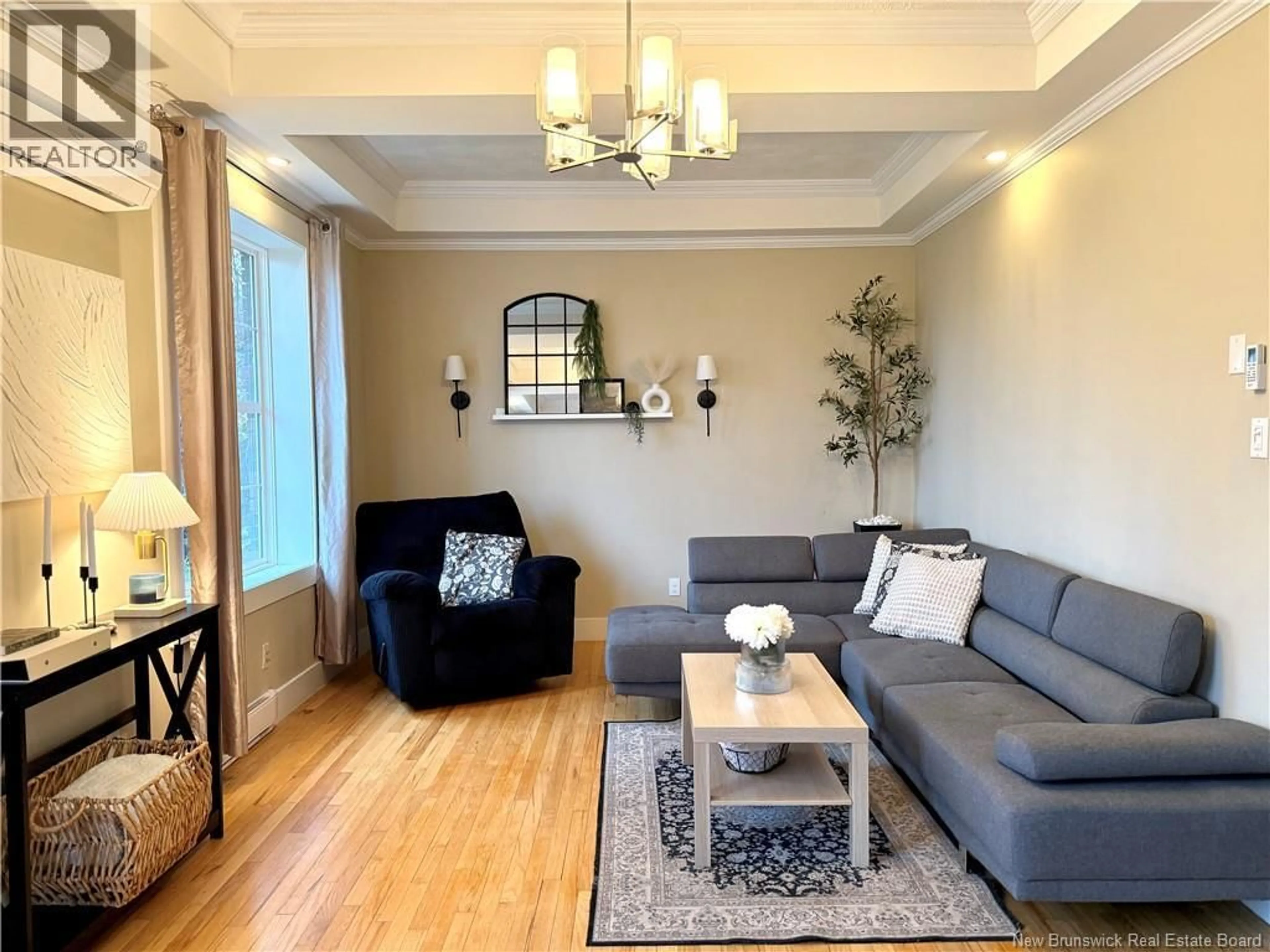 Living room with furniture, wood/laminate floor for 8 CONWAY STREET, Edmundston New Brunswick E3V1Z1