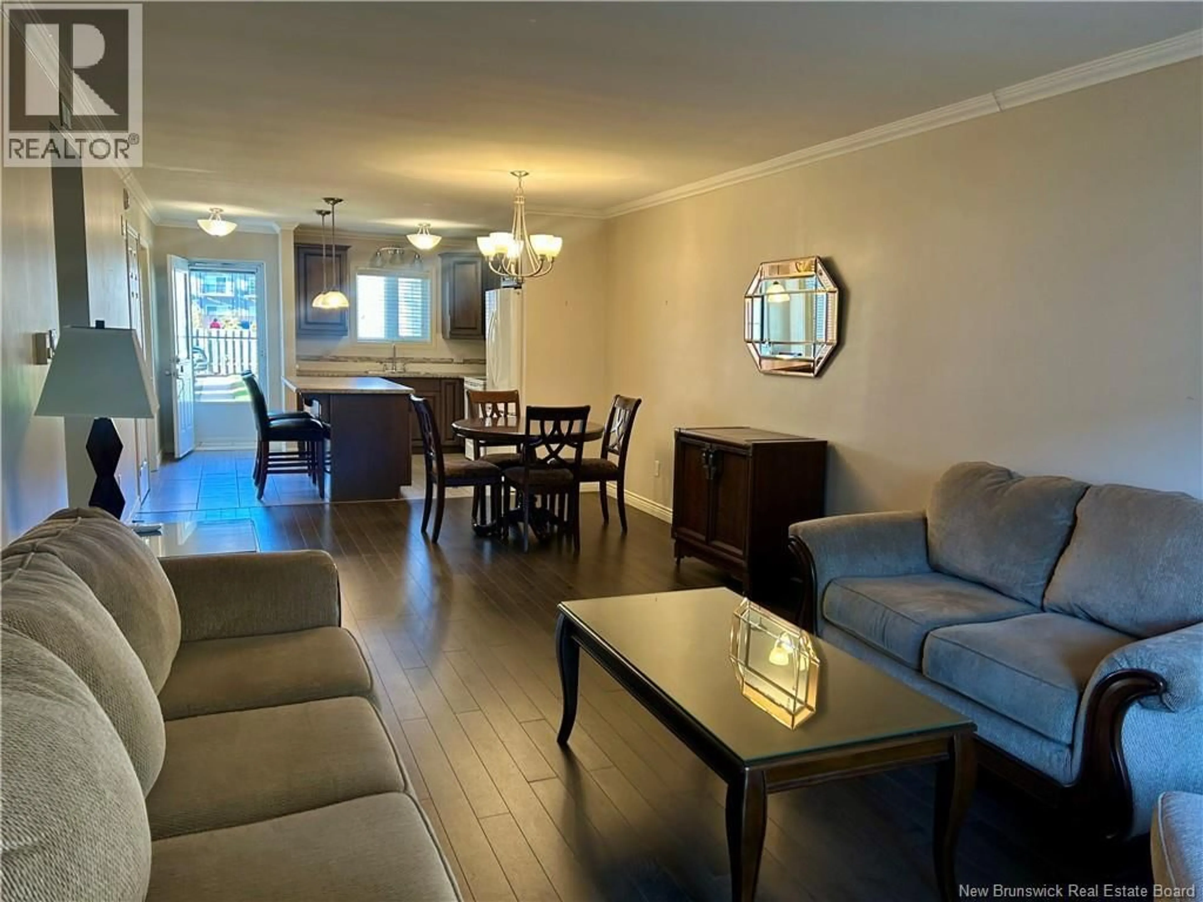 Living room with furniture, wood/laminate floor for 8 - 331 MCLAUGHLIN DRIVE, Moncton New Brunswick E1A4R3