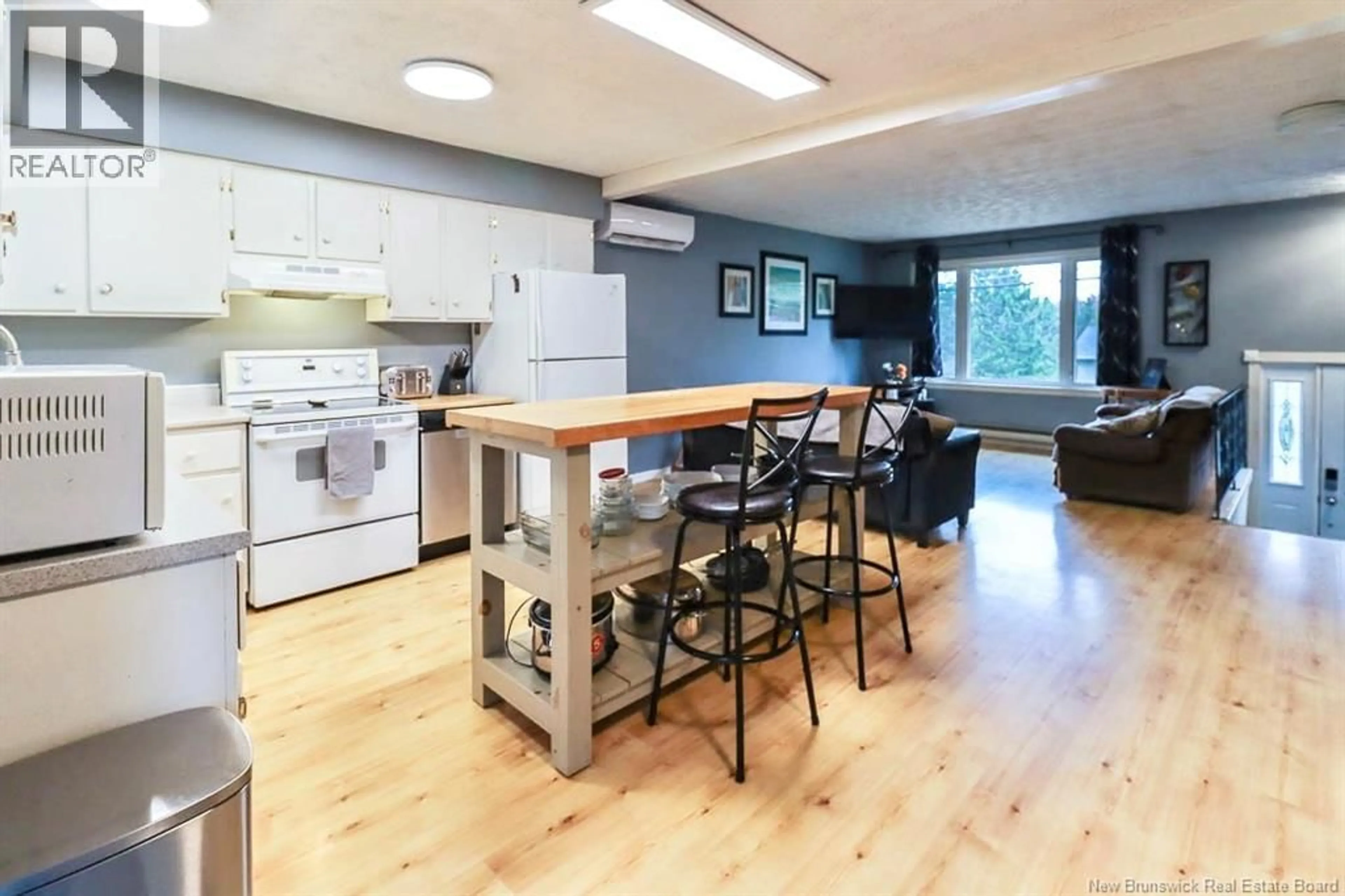 Open concept kitchen, wood/laminate floor for 57 MONARCH DRIVE, Quispamsis New Brunswick E2G1P2