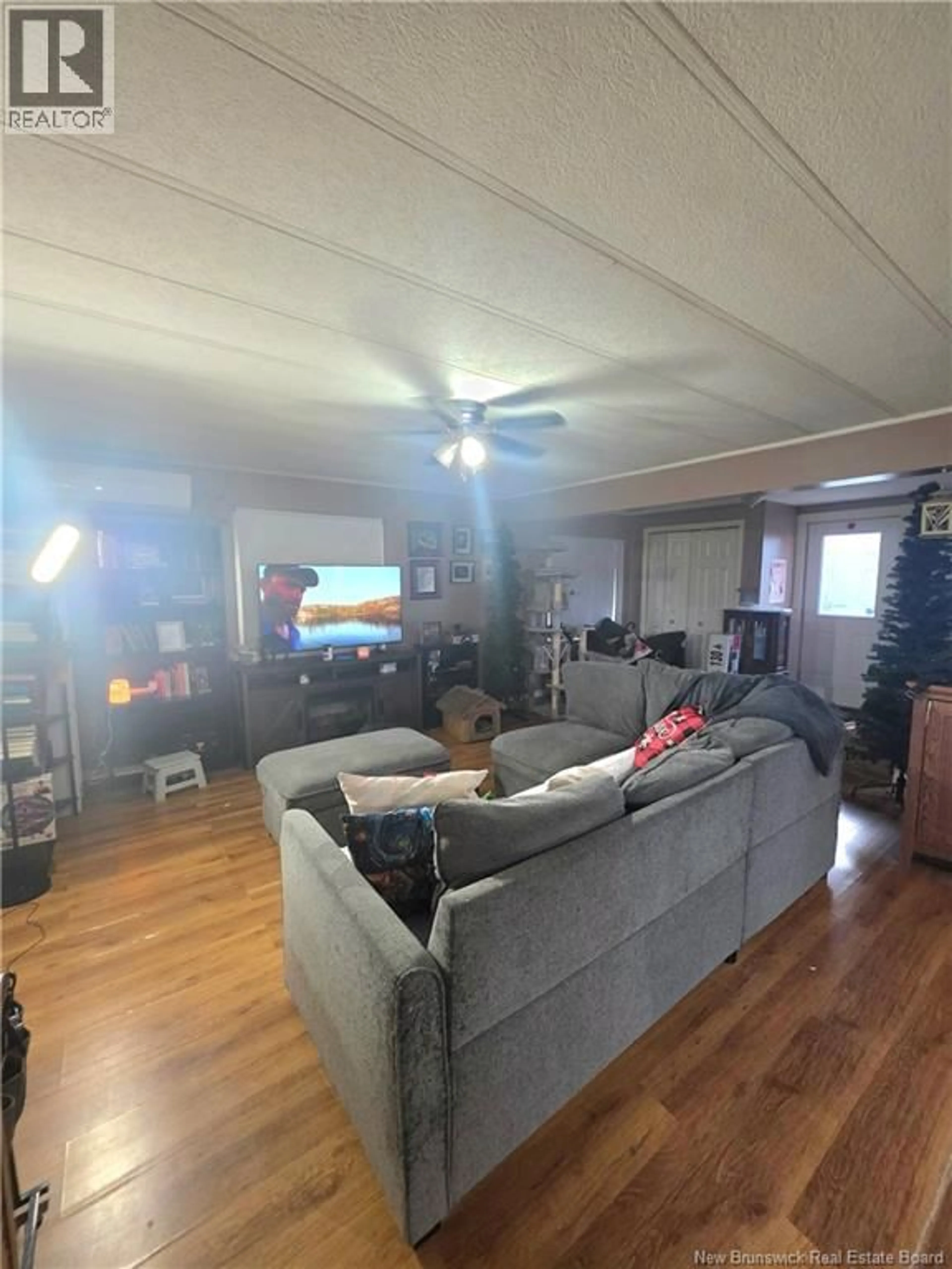 Living room with furniture, wood/laminate floor for 19 BRUN, Cap-Pelé New Brunswick E4N1N3