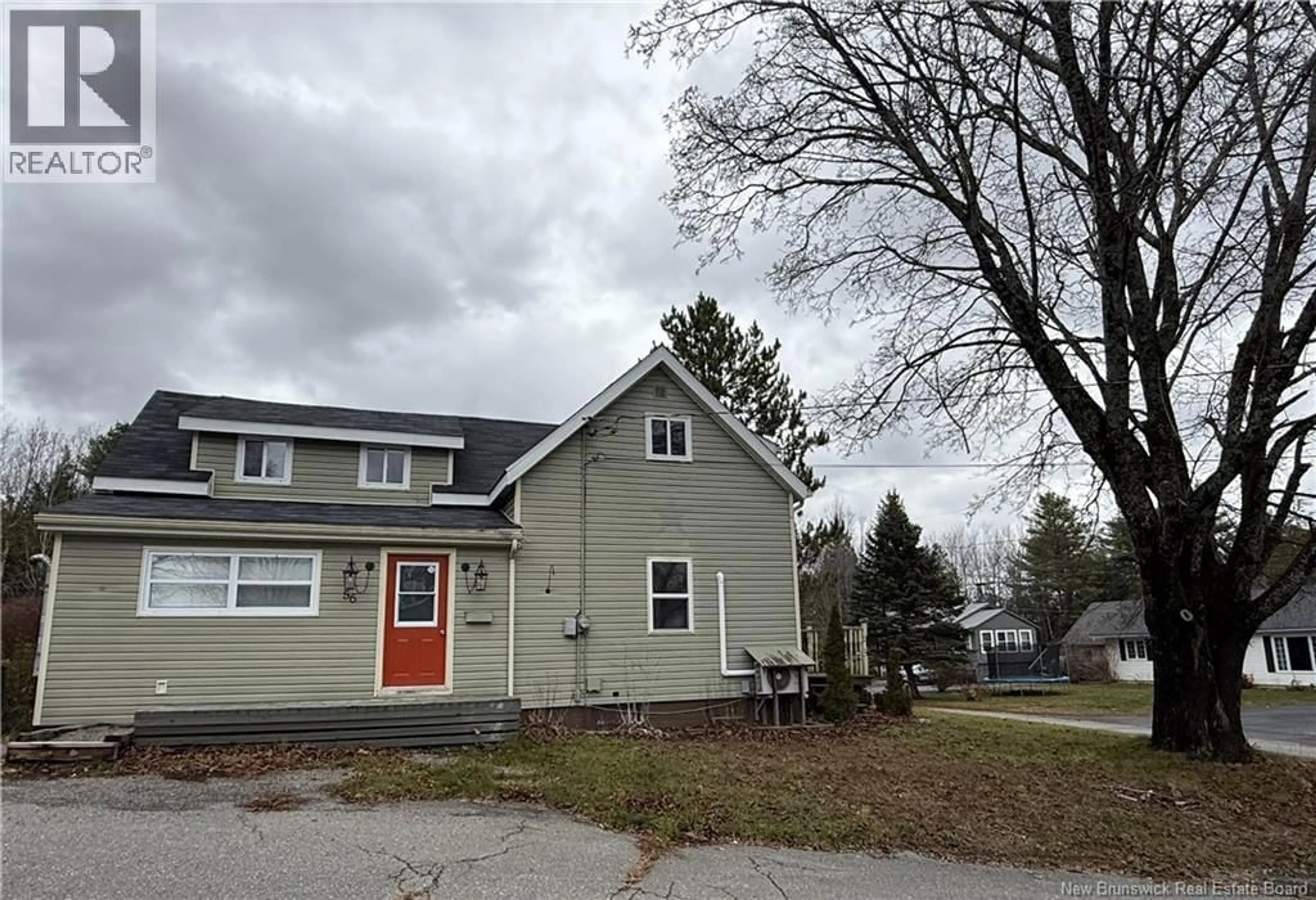 Home with vinyl exterior material, street for 56 ELM STREET, St. Stephen New Brunswick E3L2S8