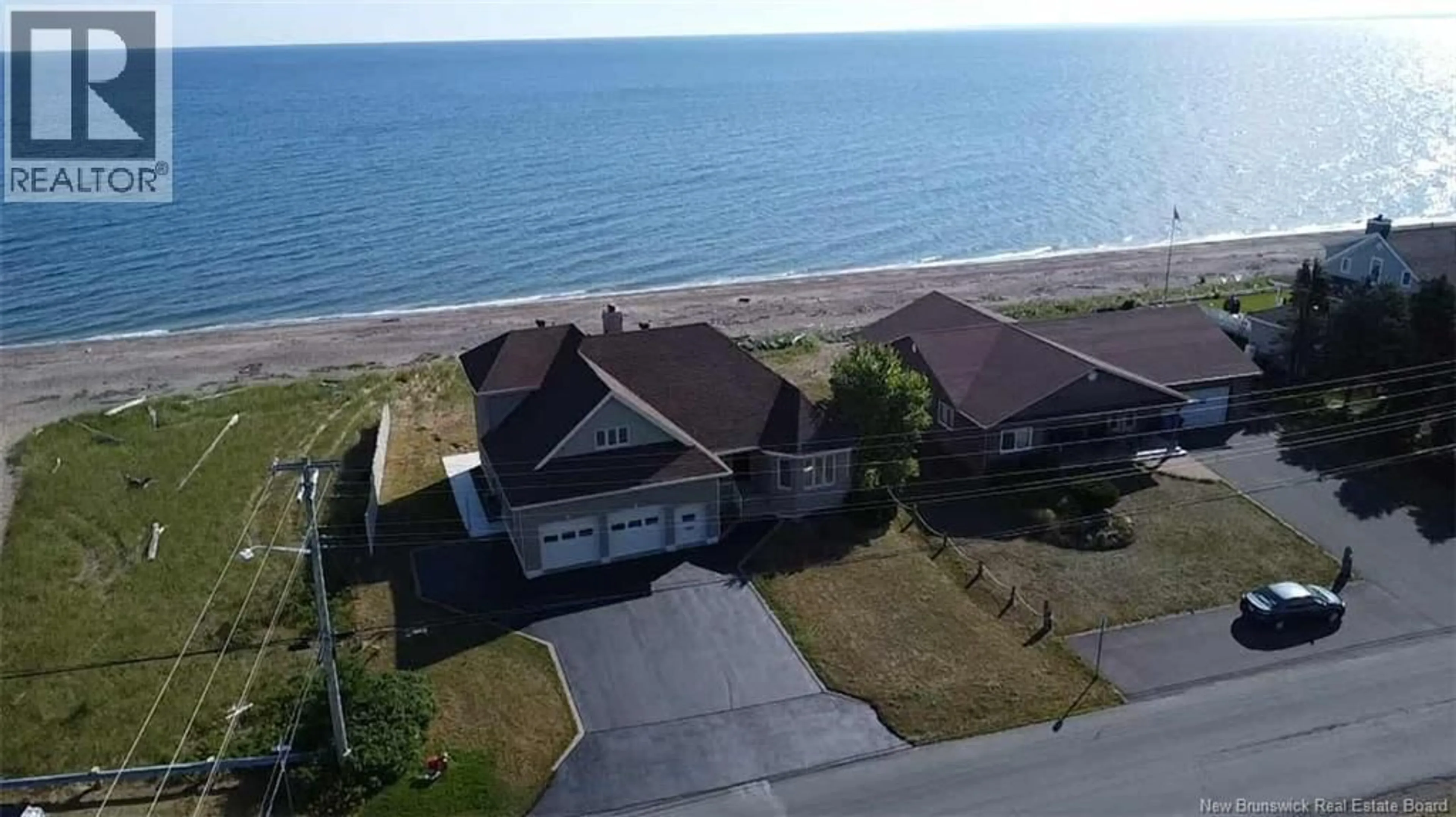 A pic from outside/outdoor area/front of a property/back of a property/a pic from drone, water/lake/river/ocean view for 1185 JACQUES CARTIER STREET, Beresford New Brunswick E8K1A6