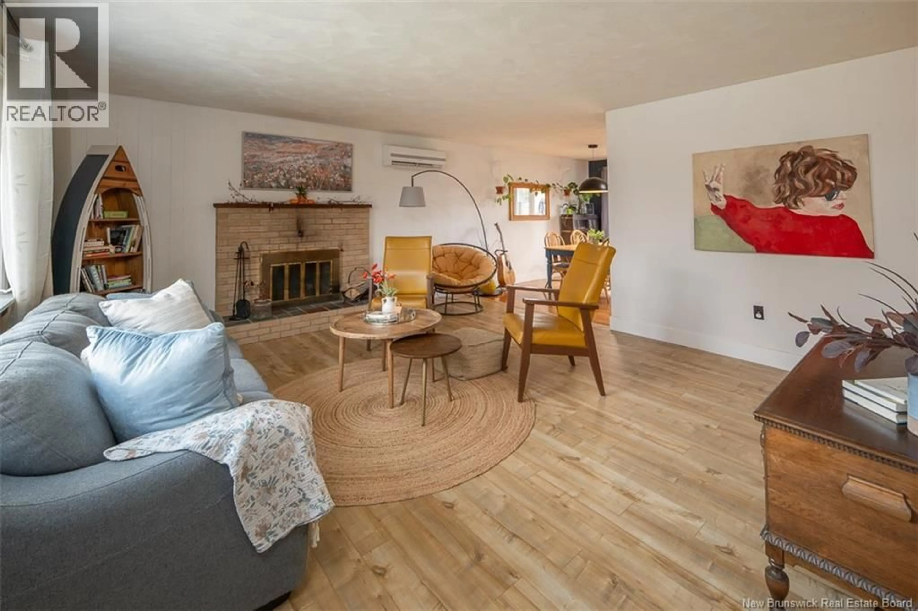 Living room with furniture, wood/laminate floor for 16 CORONATION COURT, Fredericton New Brunswick E3A4K4