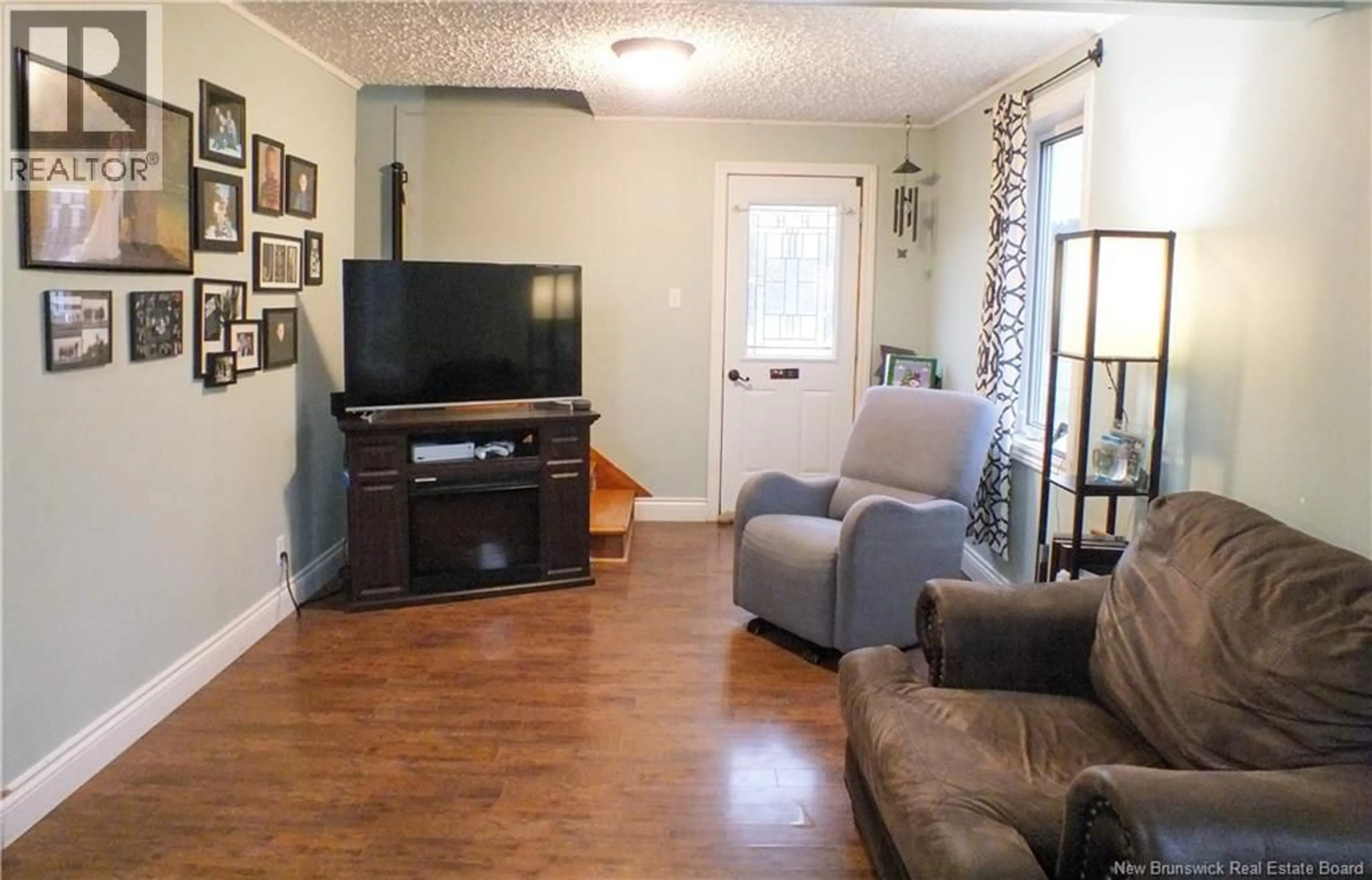 Living room with furniture, wood/laminate floor for 222 MAIN STREET, Aroostook New Brunswick E7H2Z7