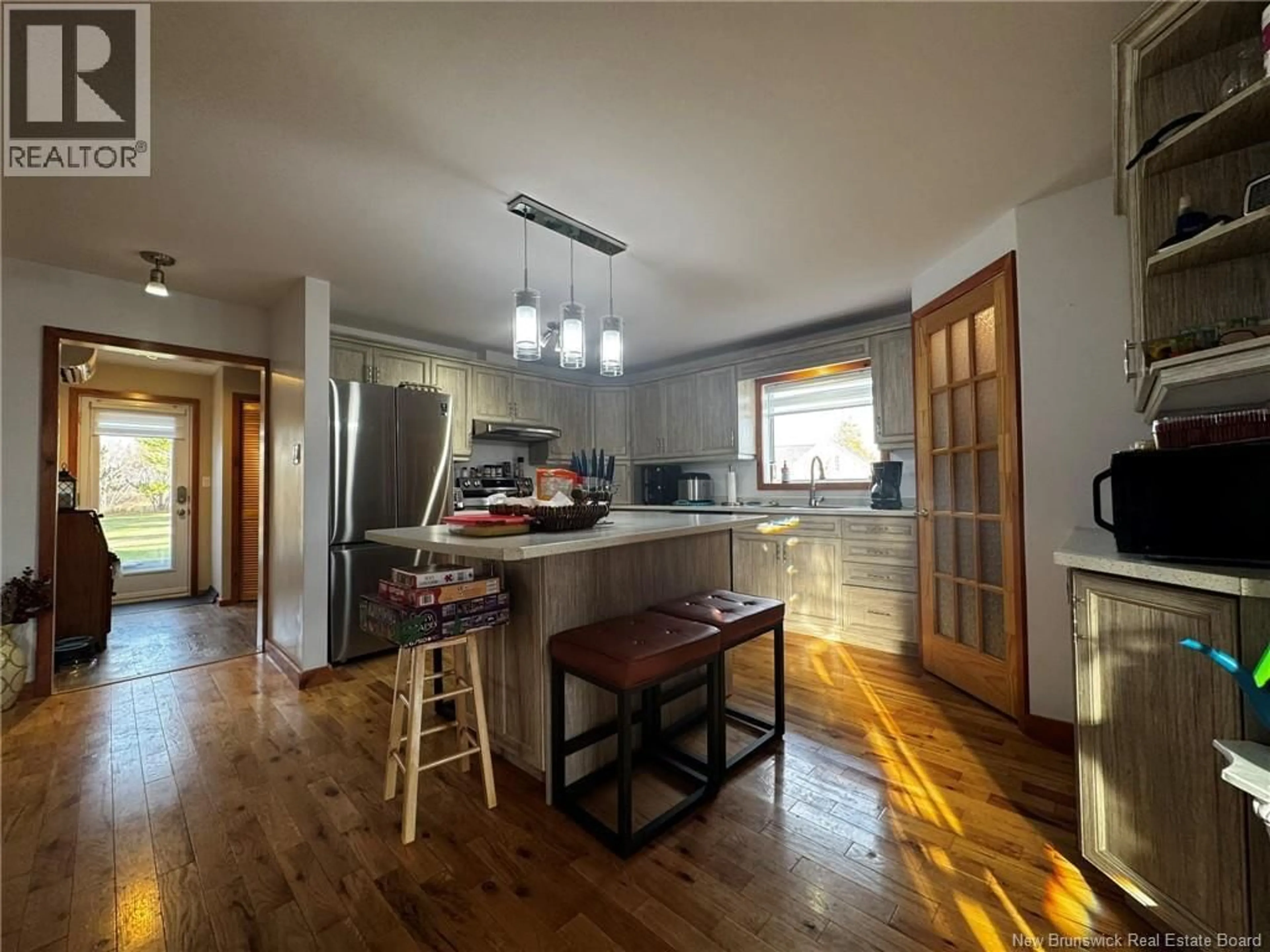 Open concept kitchen, wood/laminate floor for 197 RUE PRINCIPALE, Neguac New Brunswick E9G1R4