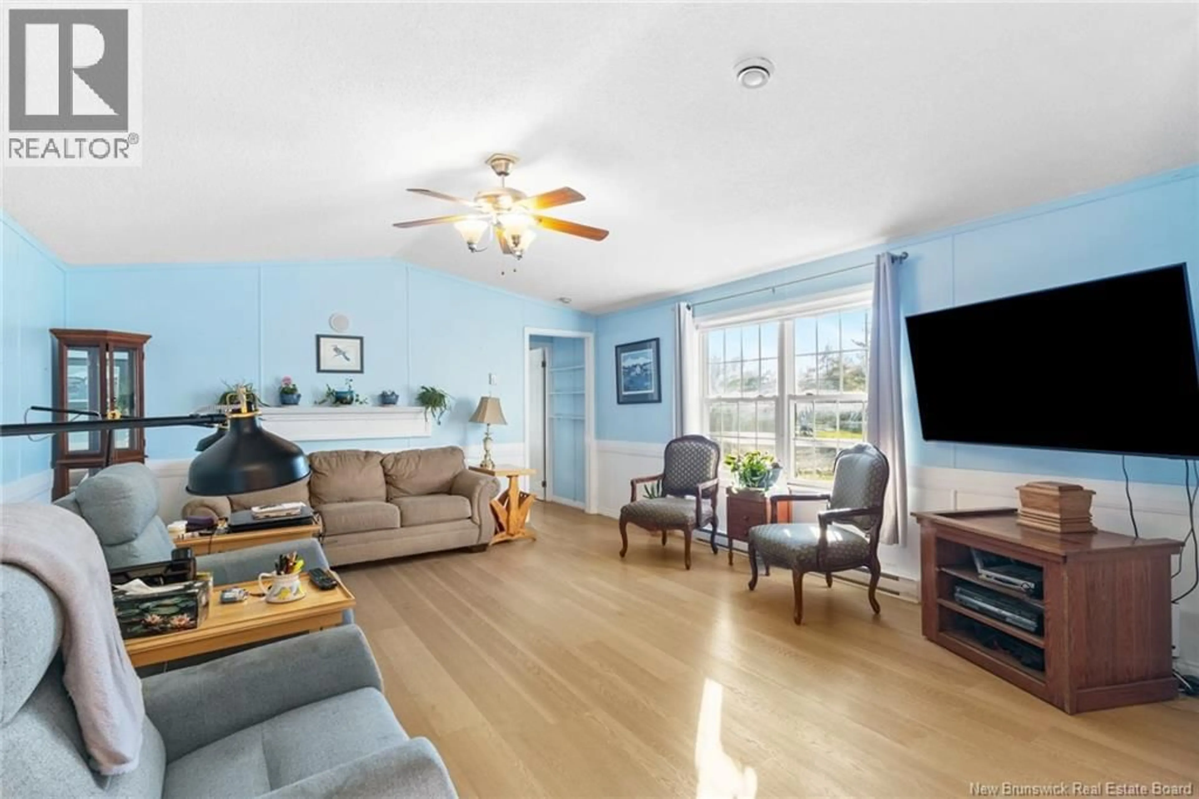 Living room with furniture, wood/laminate floor for 583 NEVERS ROAD, Waasis New Brunswick E3B9C9