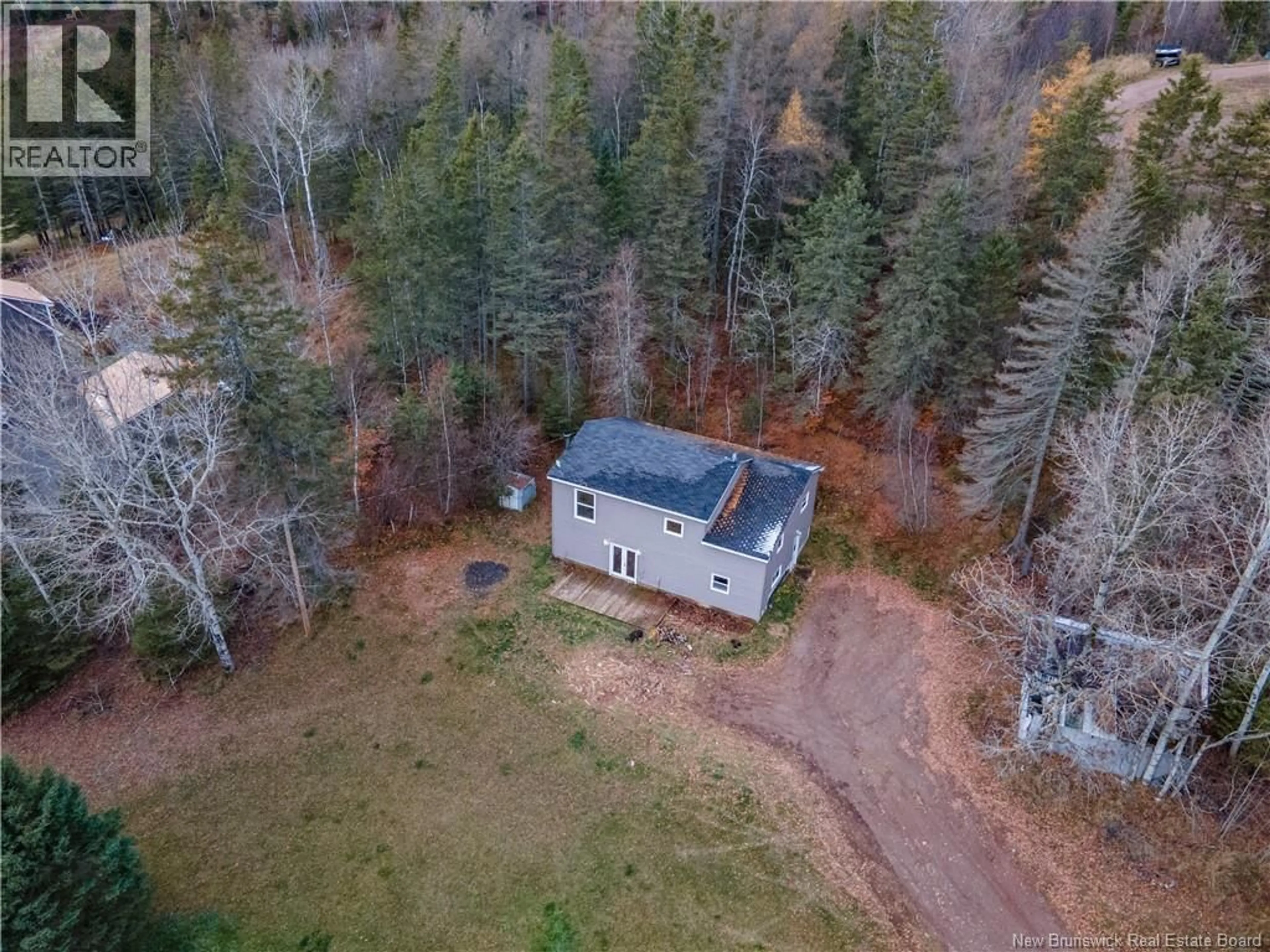A pic from outside/outdoor area/front of a property/back of a property/a pic from drone, forest/trees view for 187 MCAULEY ROAD, Smiths Creek New Brunswick E4G2P5
