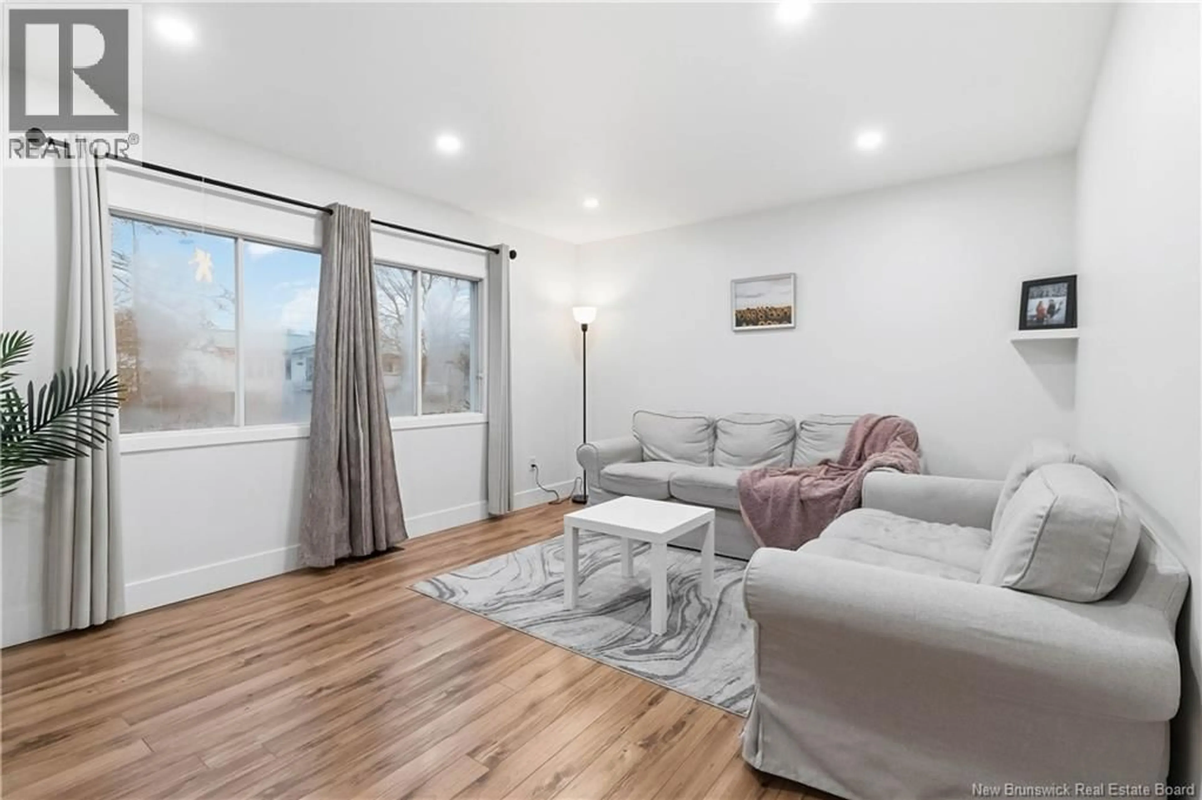 Living room with furniture, wood/laminate floor for 10 FROST STREET, Riverview New Brunswick E1B4C9