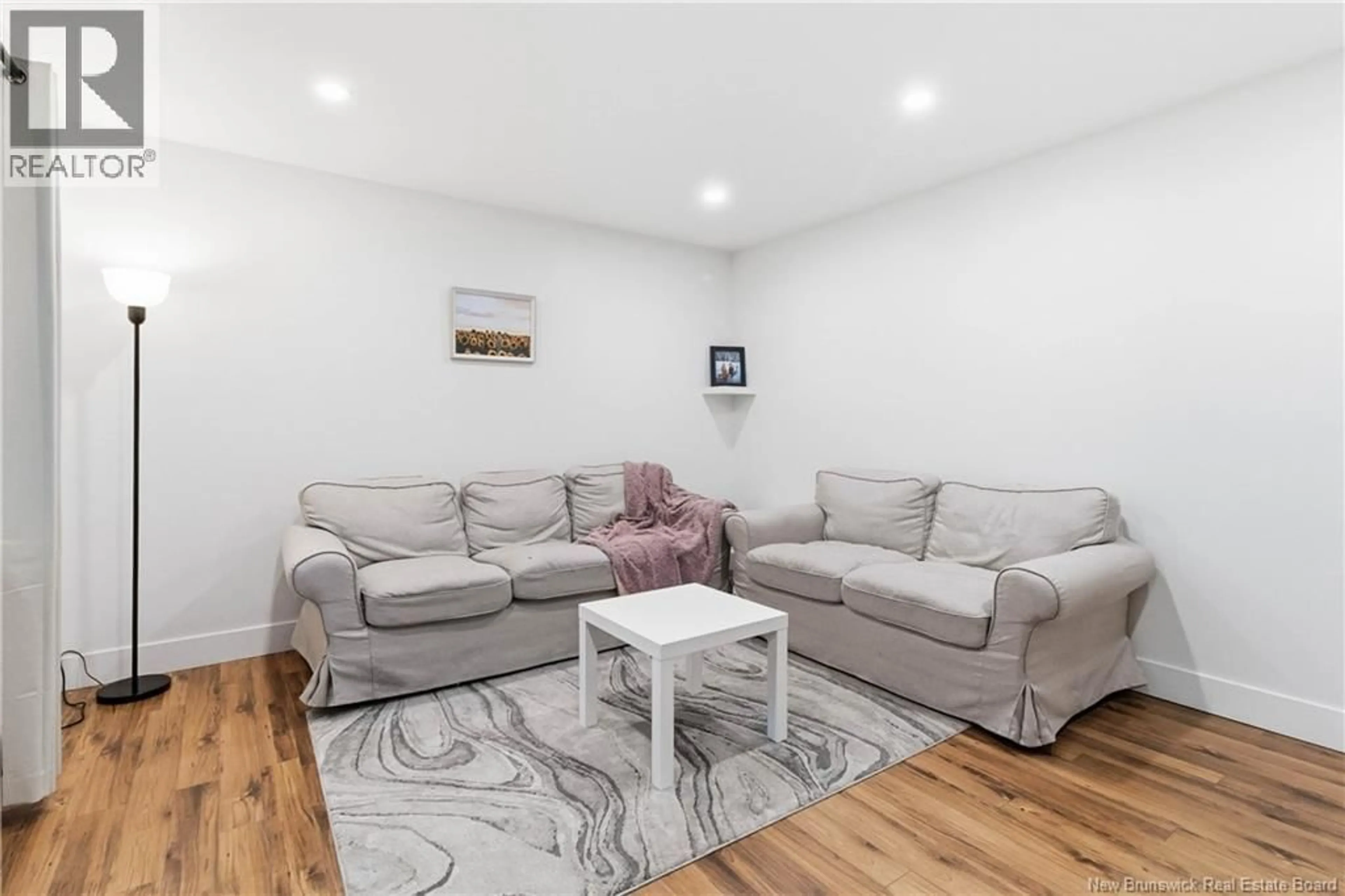 Living room with furniture, wood/laminate floor for 10 FROST STREET, Riverview New Brunswick E1B4C9