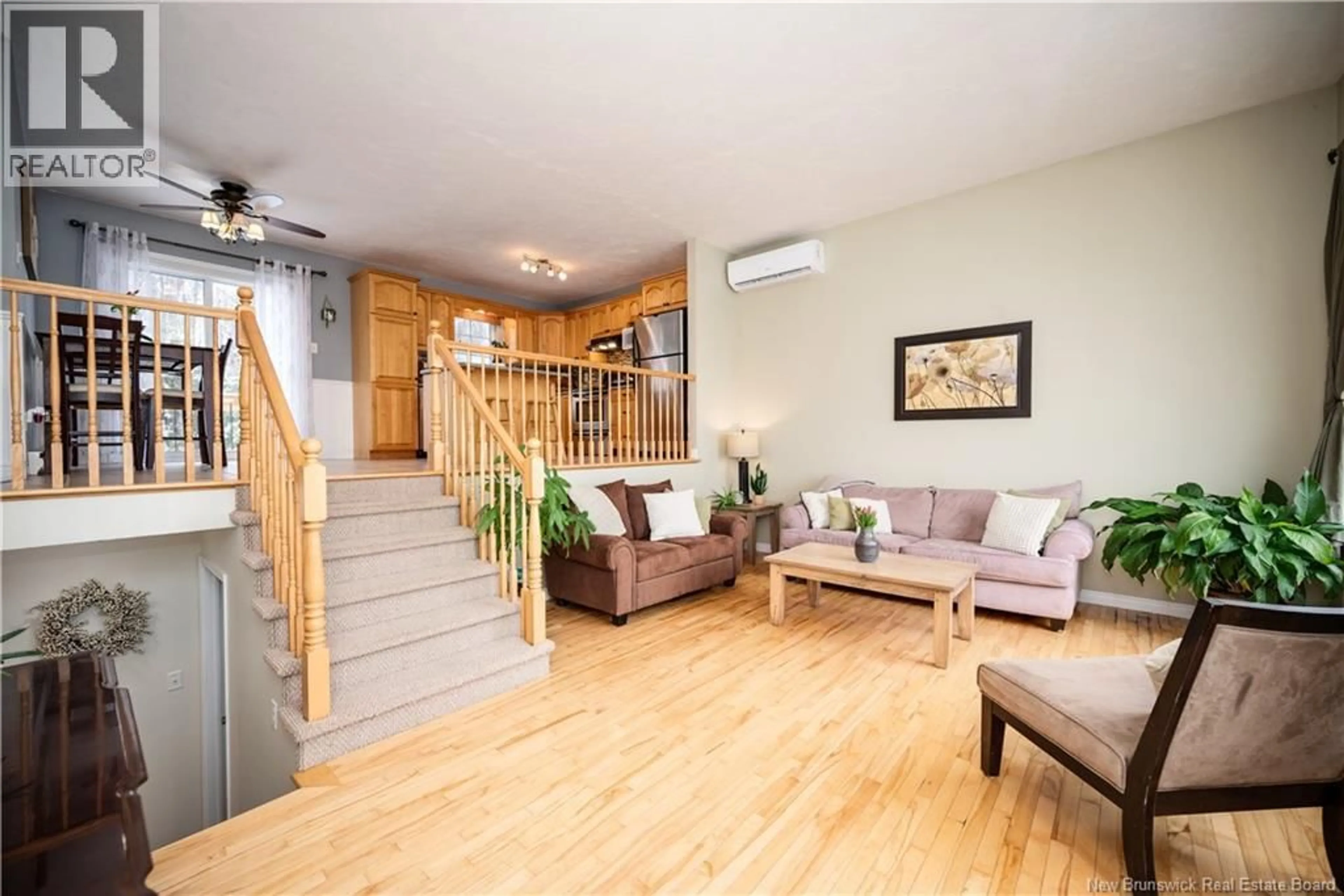 Living room with furniture, wood/laminate floor for 23 TALITH STREET, Moncton New Brunswick E1E4V4