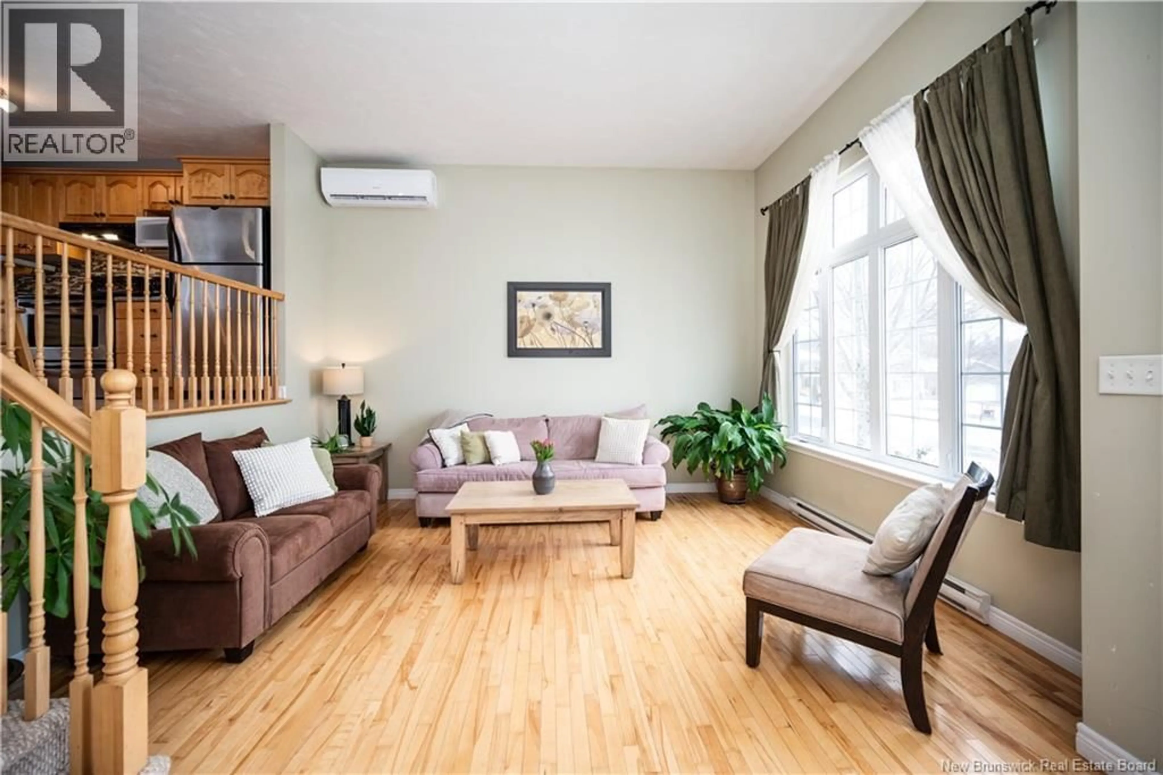 Living room with furniture, wood/laminate floor for 23 TALITH STREET, Moncton New Brunswick E1E4V4
