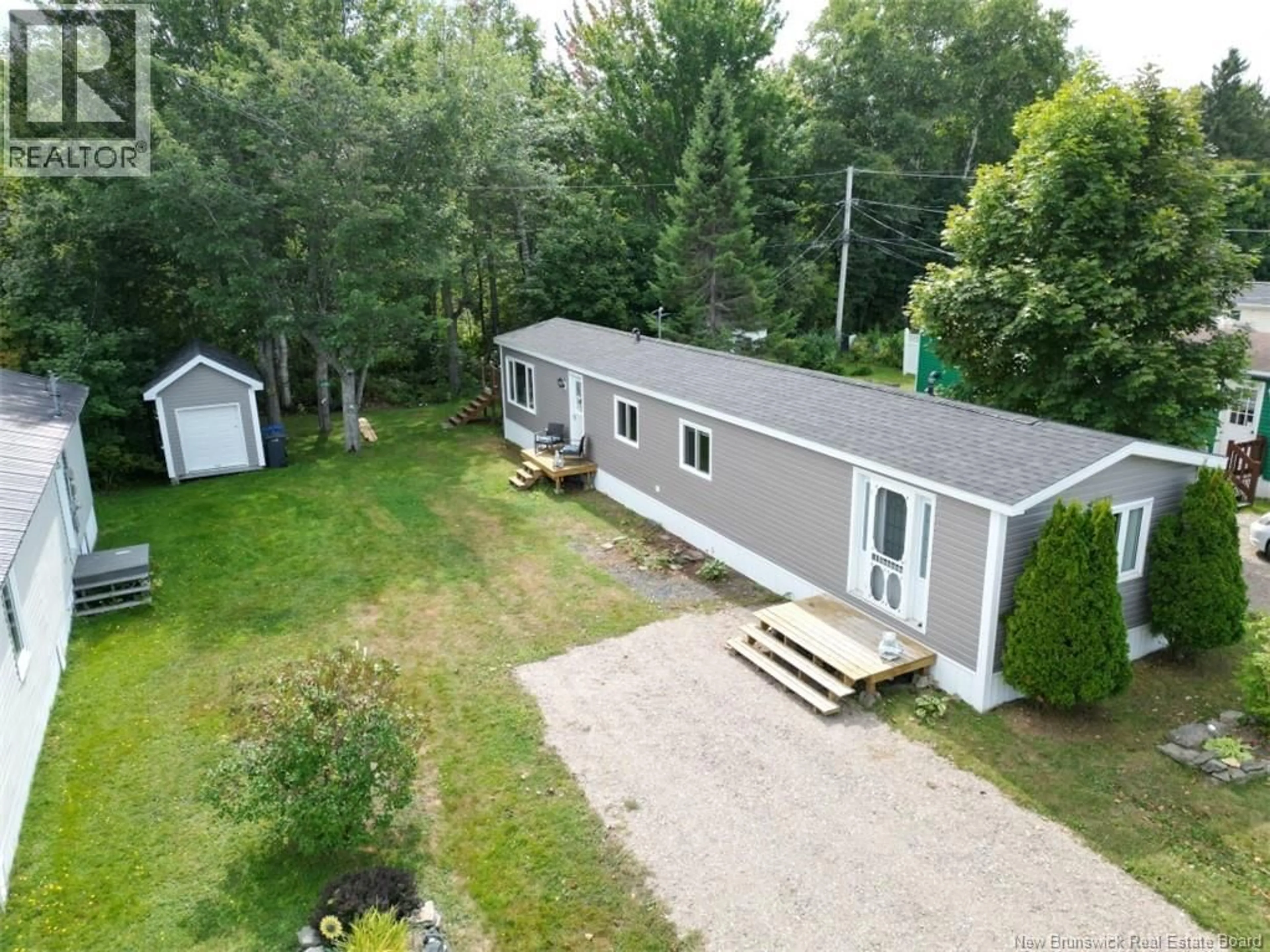 A pic from outside/outdoor area/front of a property/back of a property/a pic from drone, unknown for 235 POPLAR, Beresford New Brunswick E8K1E5