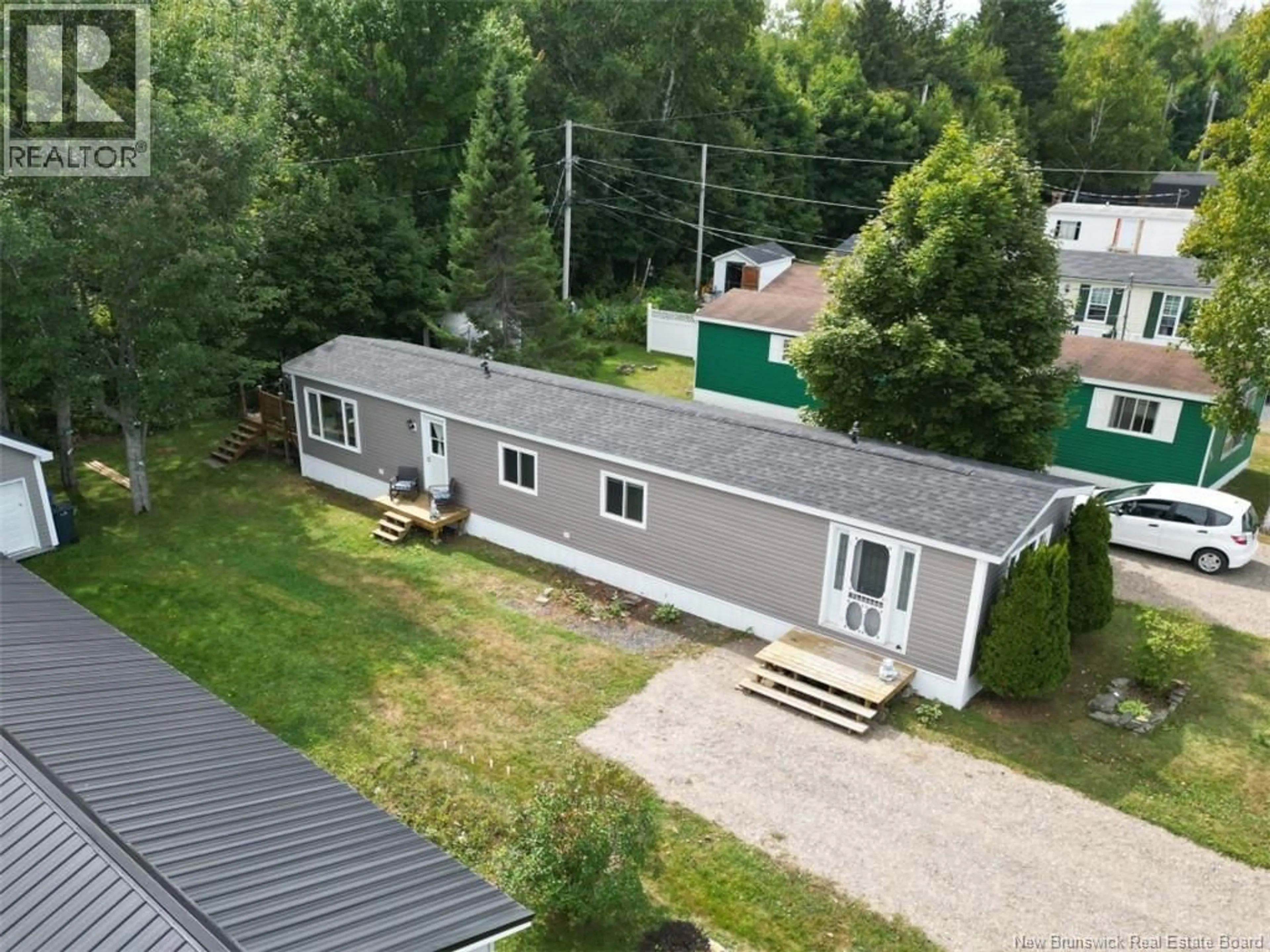 A pic from outside/outdoor area/front of a property/back of a property/a pic from drone, unknown for 235 POPLAR, Beresford New Brunswick E8K1E5