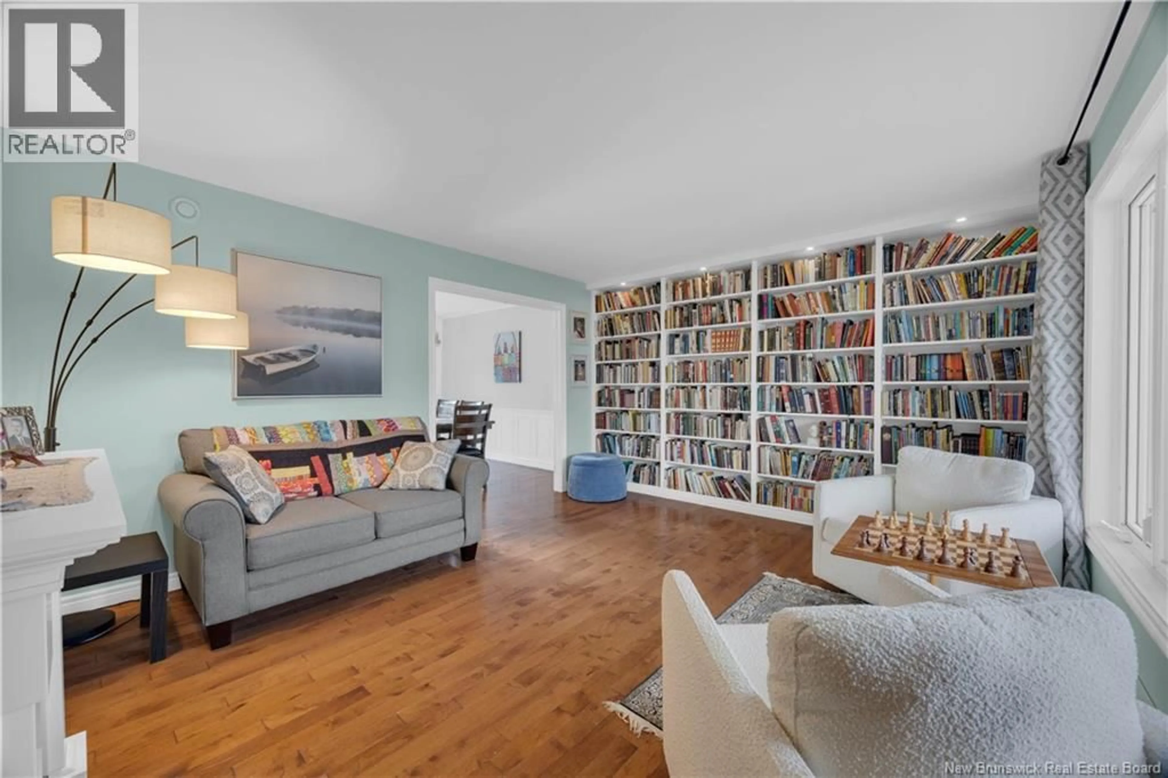 Living room with furniture, wood/laminate floor for 15 VALENTINE BOULEVARD, Saint John New Brunswick E2M5G9