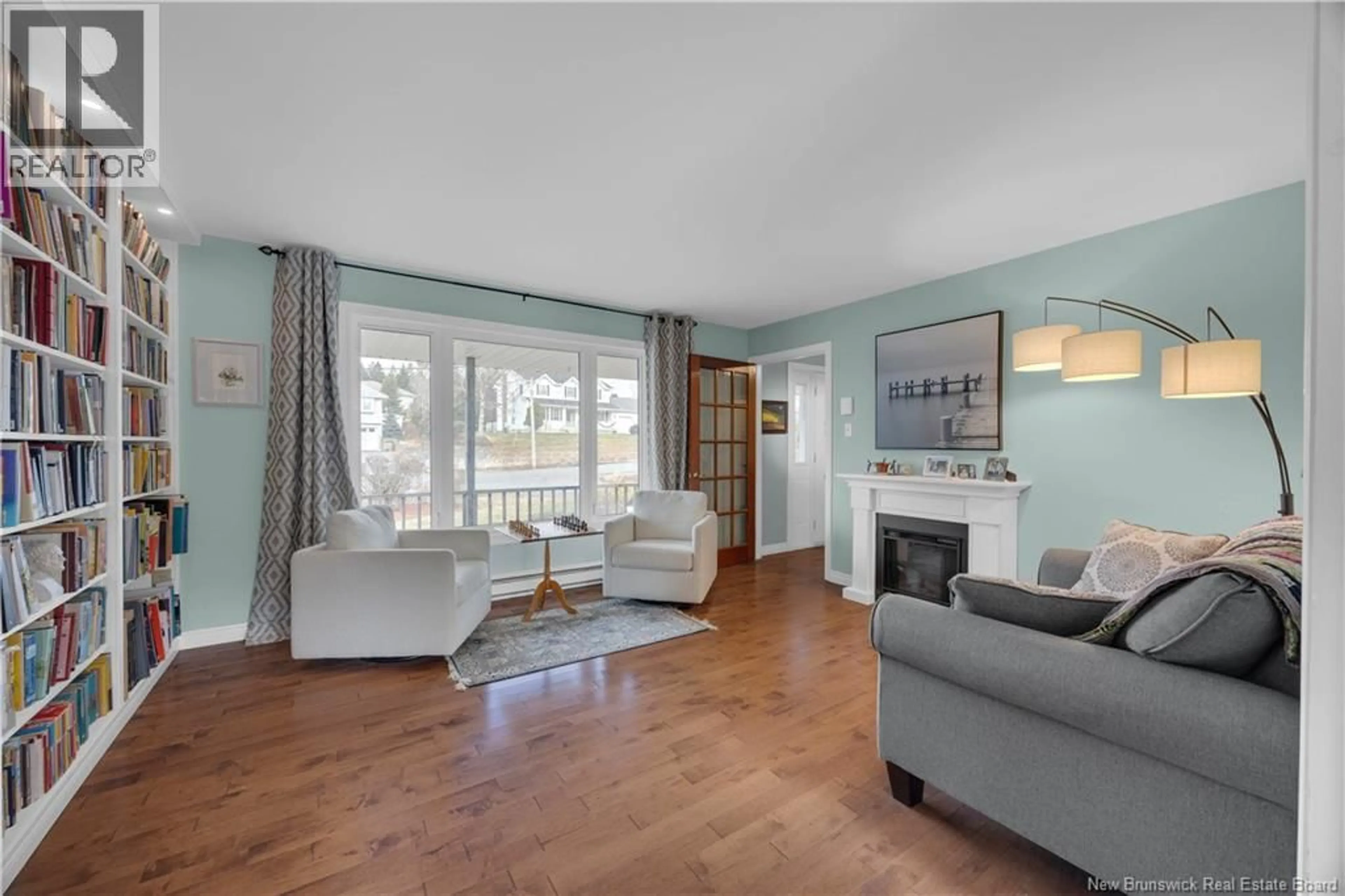 Living room with furniture, wood/laminate floor for 15 VALENTINE BOULEVARD, Saint John New Brunswick E2M5G9