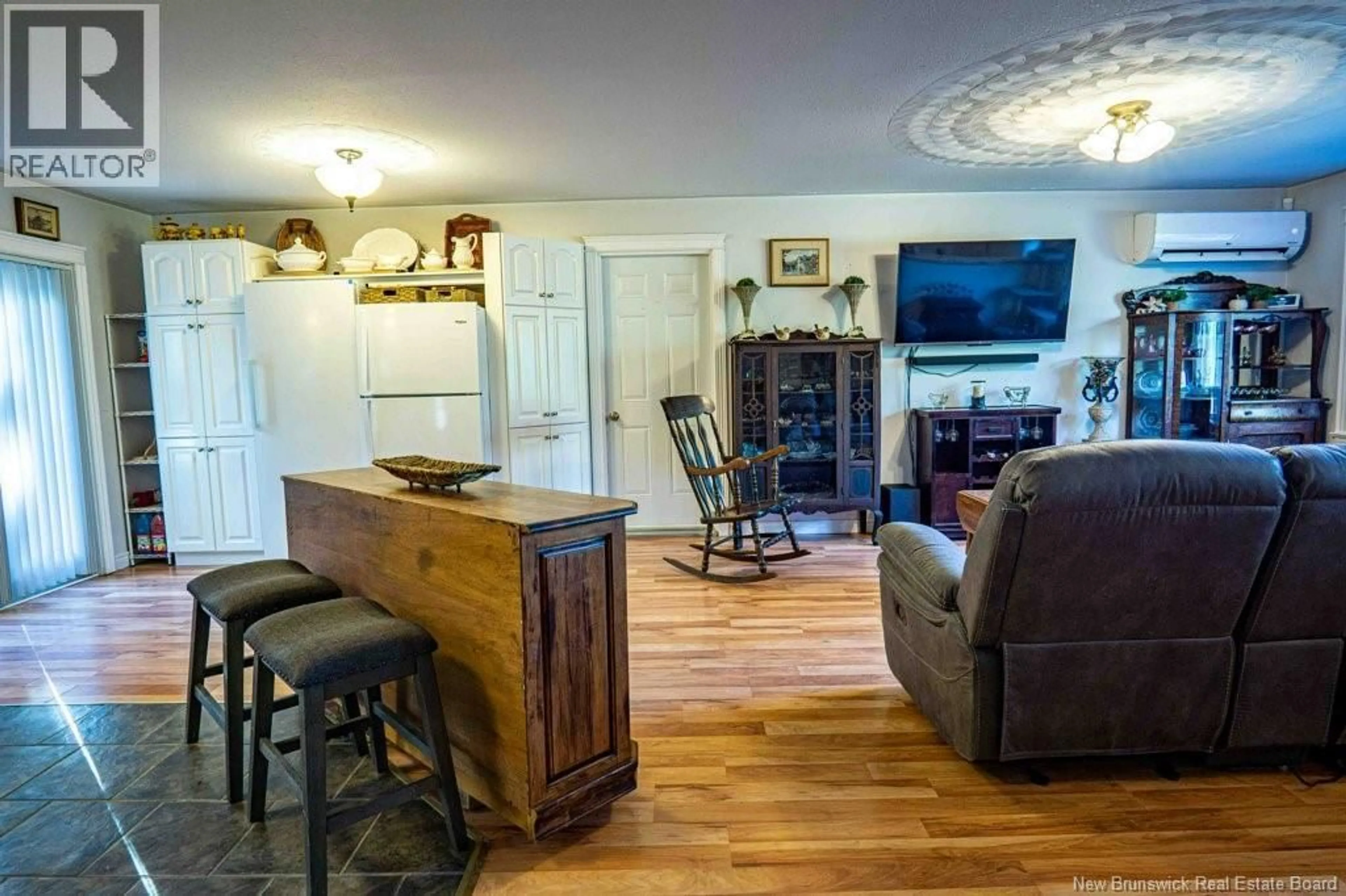 Living room with furniture, wood/laminate floor for 15 EYRE STREET, Noonan New Brunswick E3A0A7