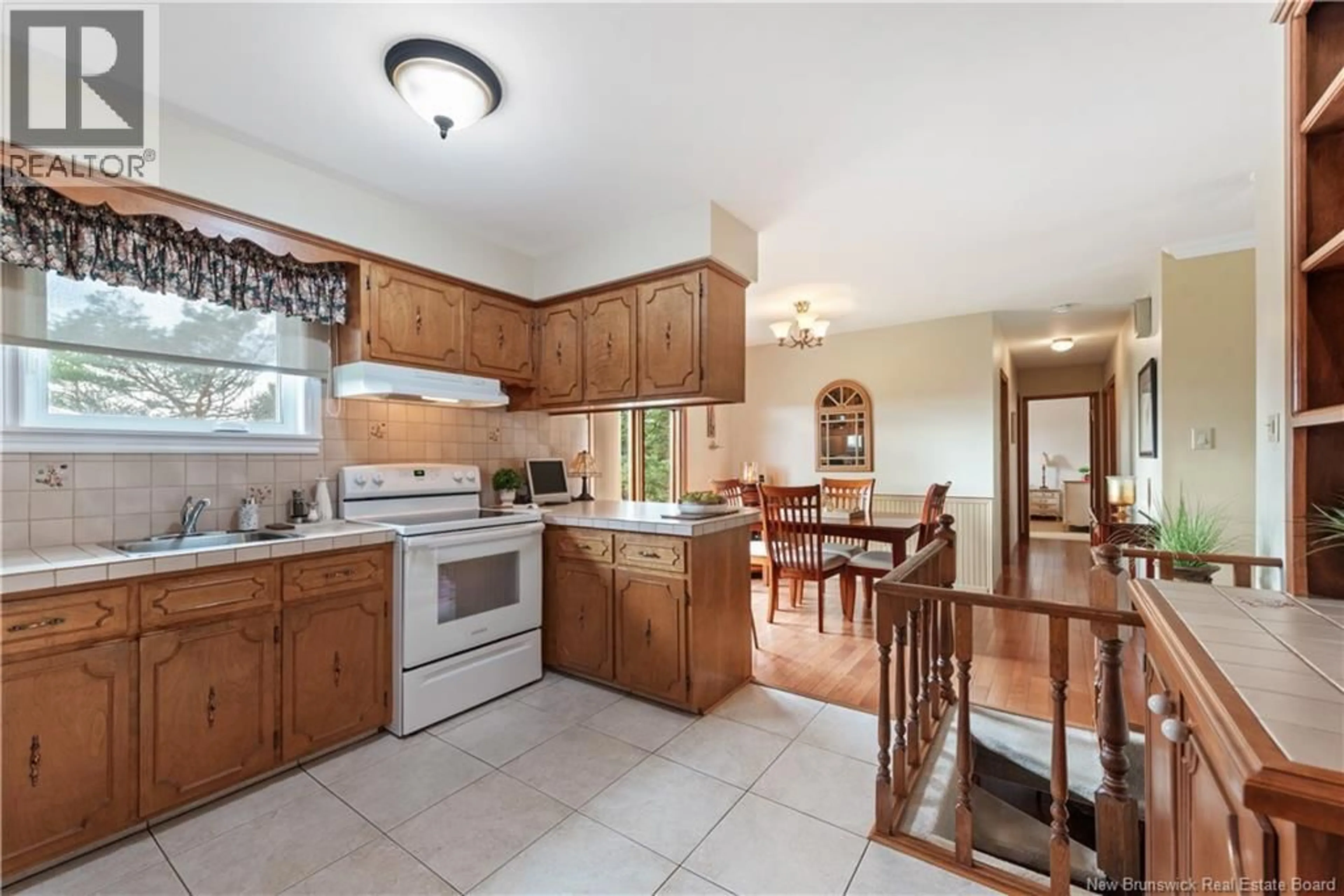 Open concept kitchen, ceramic/tile floor for 1803 AMIRAULT, Dieppe New Brunswick E1A7J7