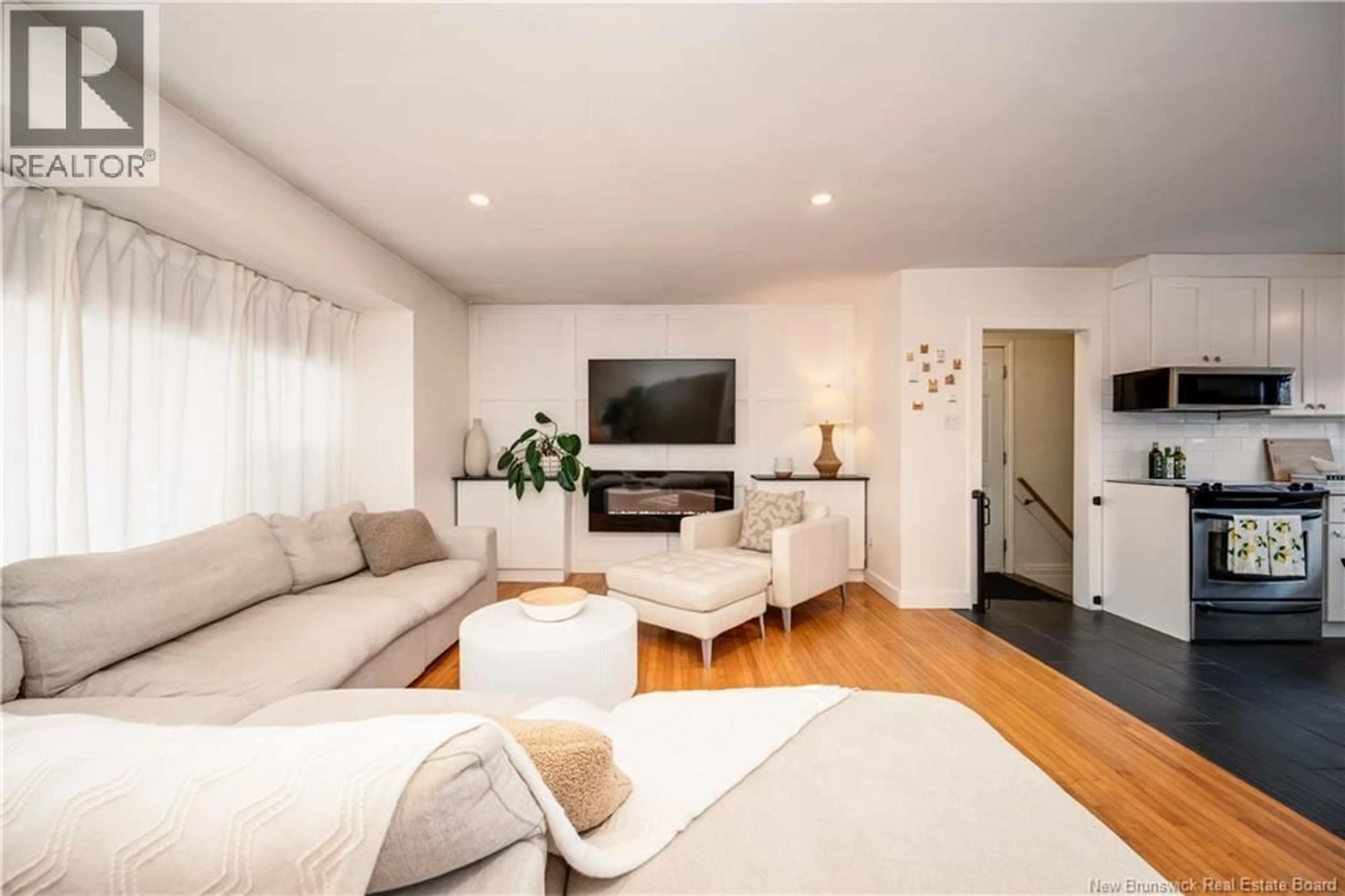 Living room with furniture, wood/laminate floor for 29 HOWS, Moncton New Brunswick E1E1S9