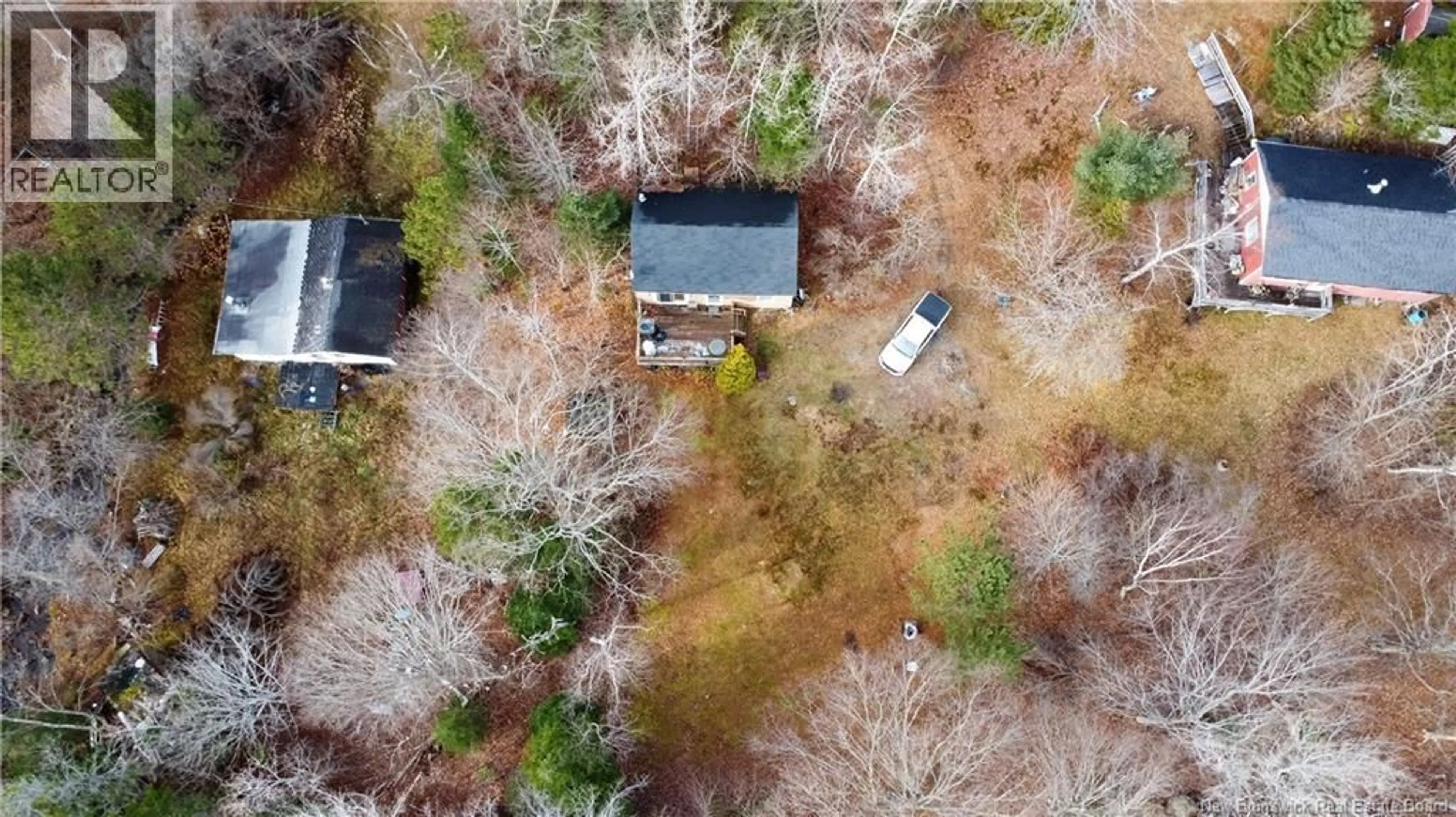 A pic from outside/outdoor area/front of a property/back of a property/a pic from drone, forest/trees view for 20 FOLEY LANE, Kingston New Brunswick E5S1B9