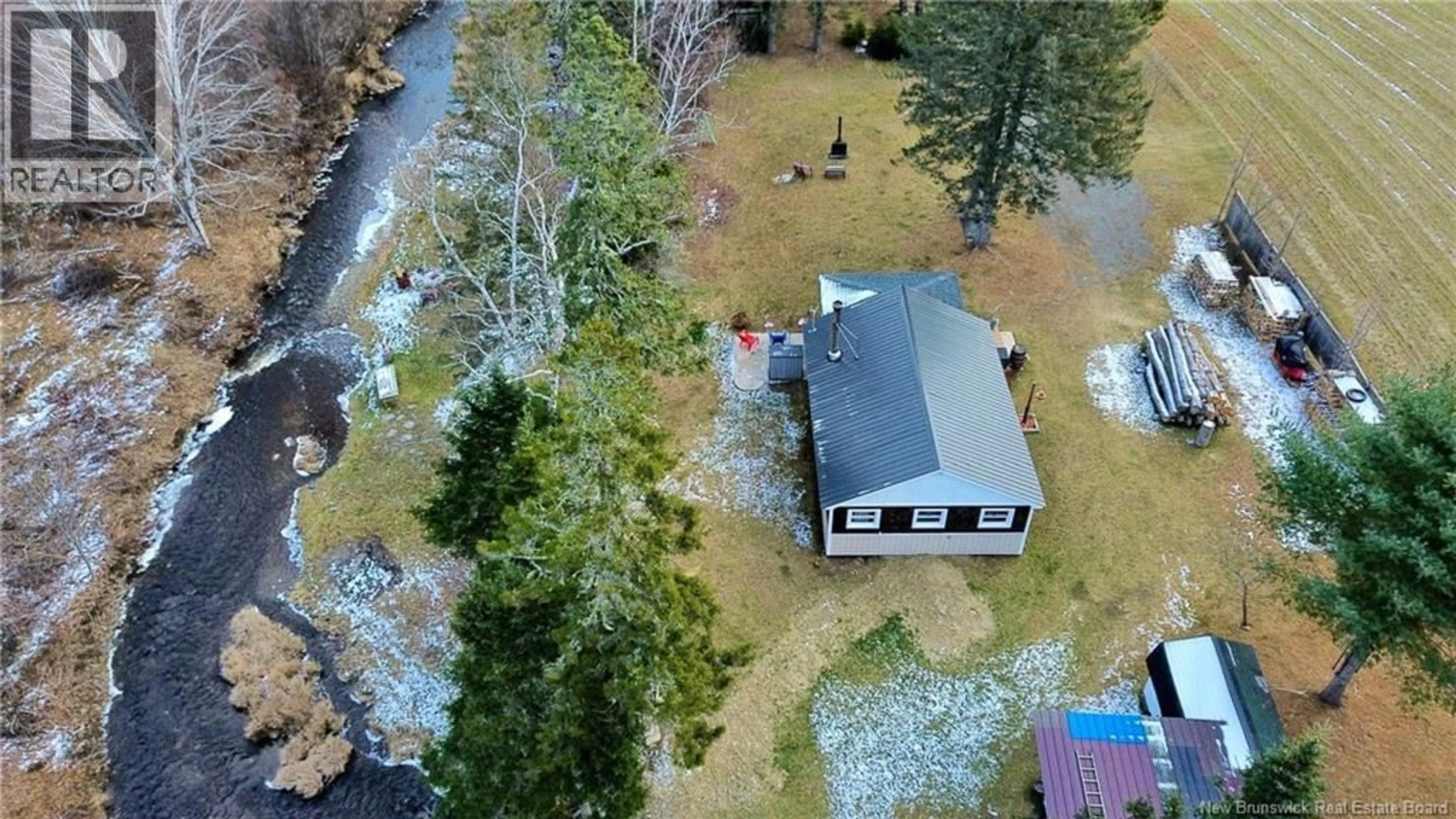 A pic from outside/outdoor area/front of a property/back of a property/a pic from drone, unknown for 15 NORTH RIDGE ROAD, Foreston New Brunswick E7L1K4