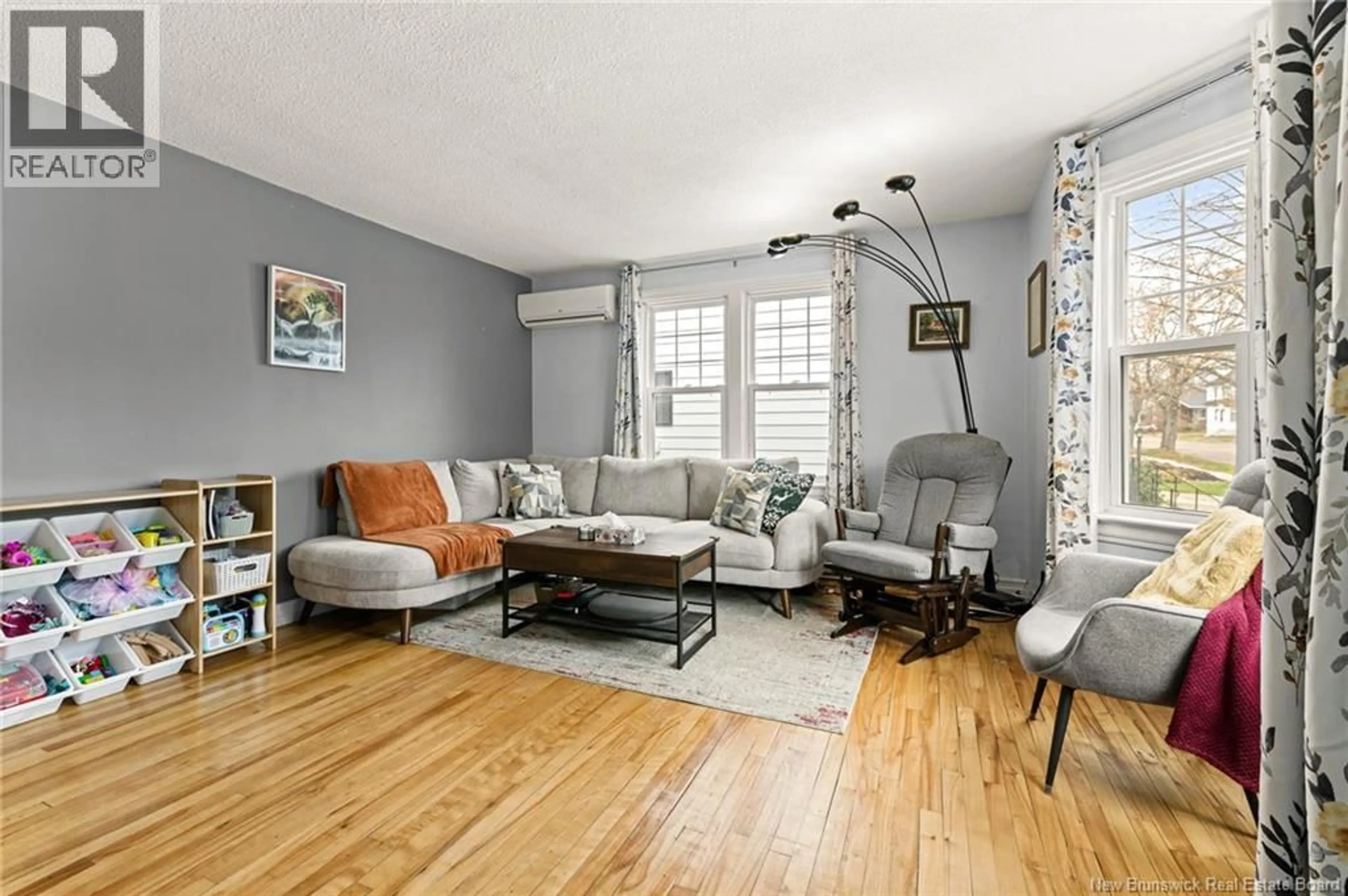 Living room with furniture, unknown for 24 GRANDVIEW AVENUE, Moncton New Brunswick E1E3J8