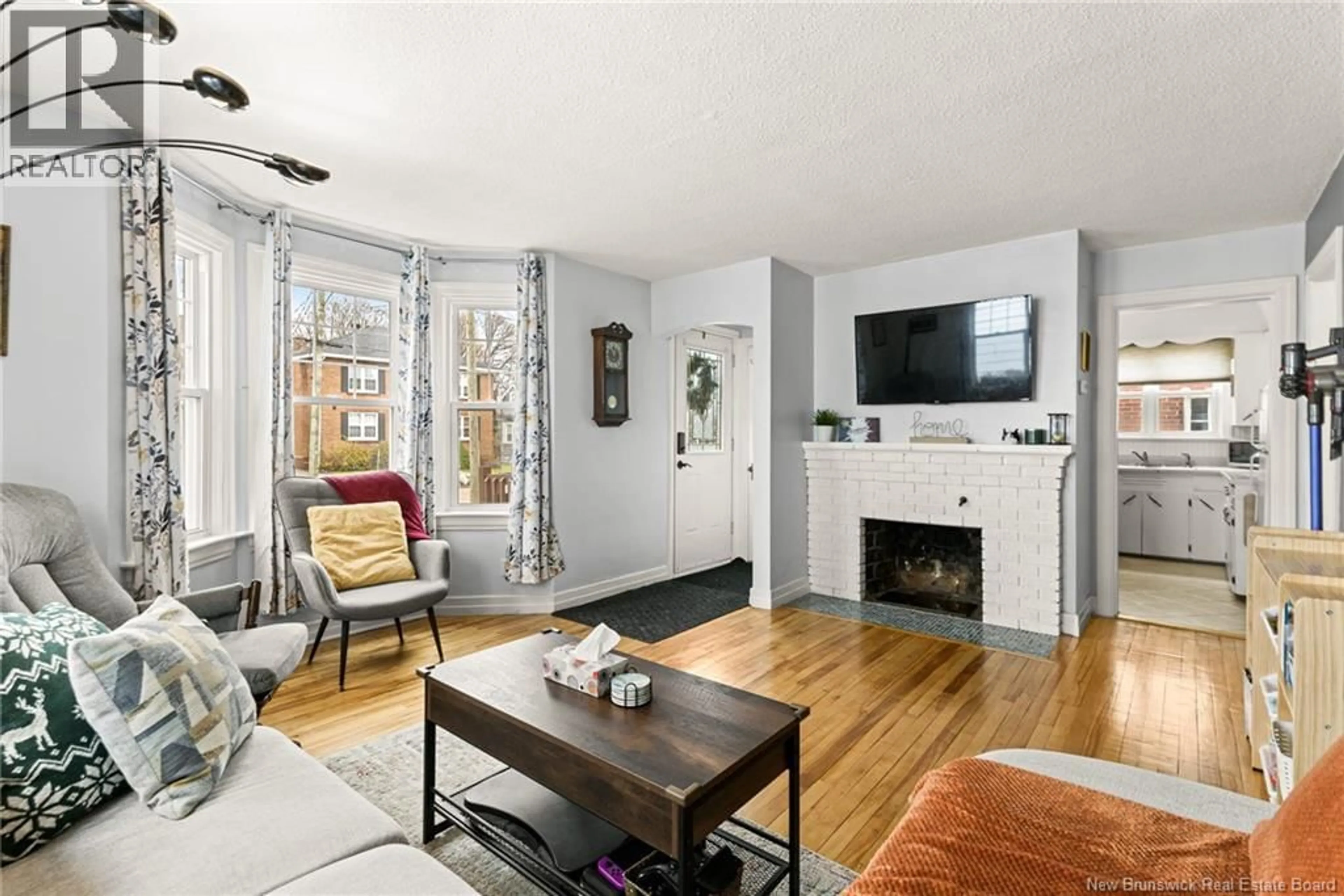 Living room with furniture, wood/laminate floor for 24 GRANDVIEW AVENUE, Moncton New Brunswick E1E3J8