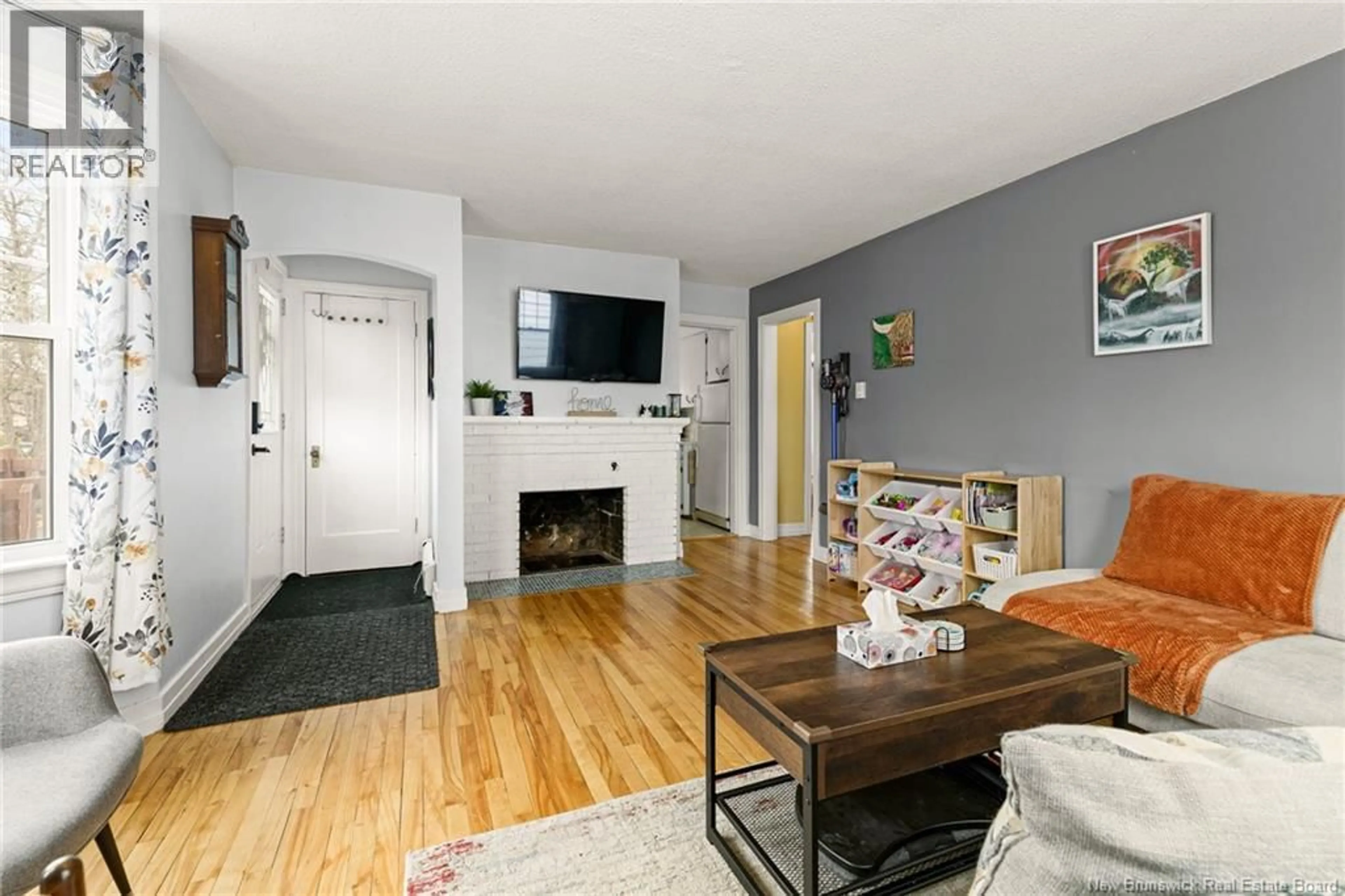 Living room with furniture, wood/laminate floor for 24 GRANDVIEW AVENUE, Moncton New Brunswick E1E3J8