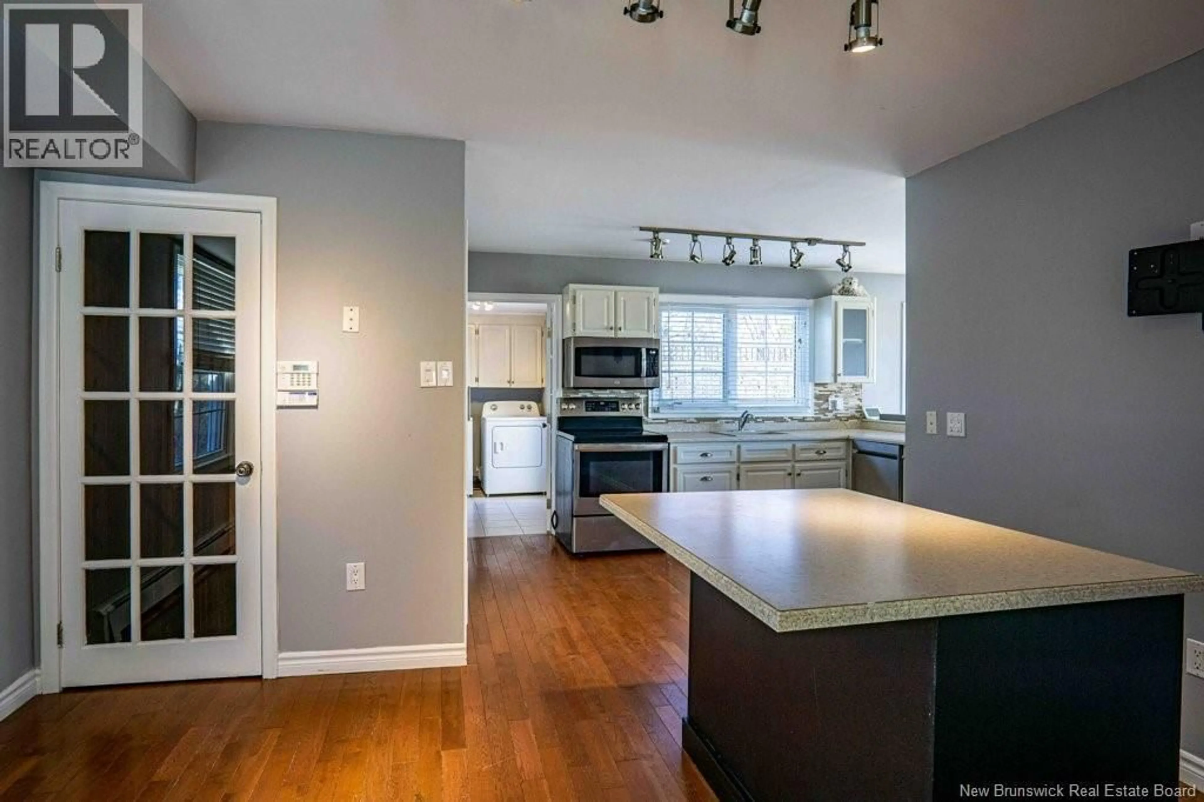 Open concept kitchen, wood/laminate floor for 7 CRESTLINE ROAD, Rothesay New Brunswick E2H1C5