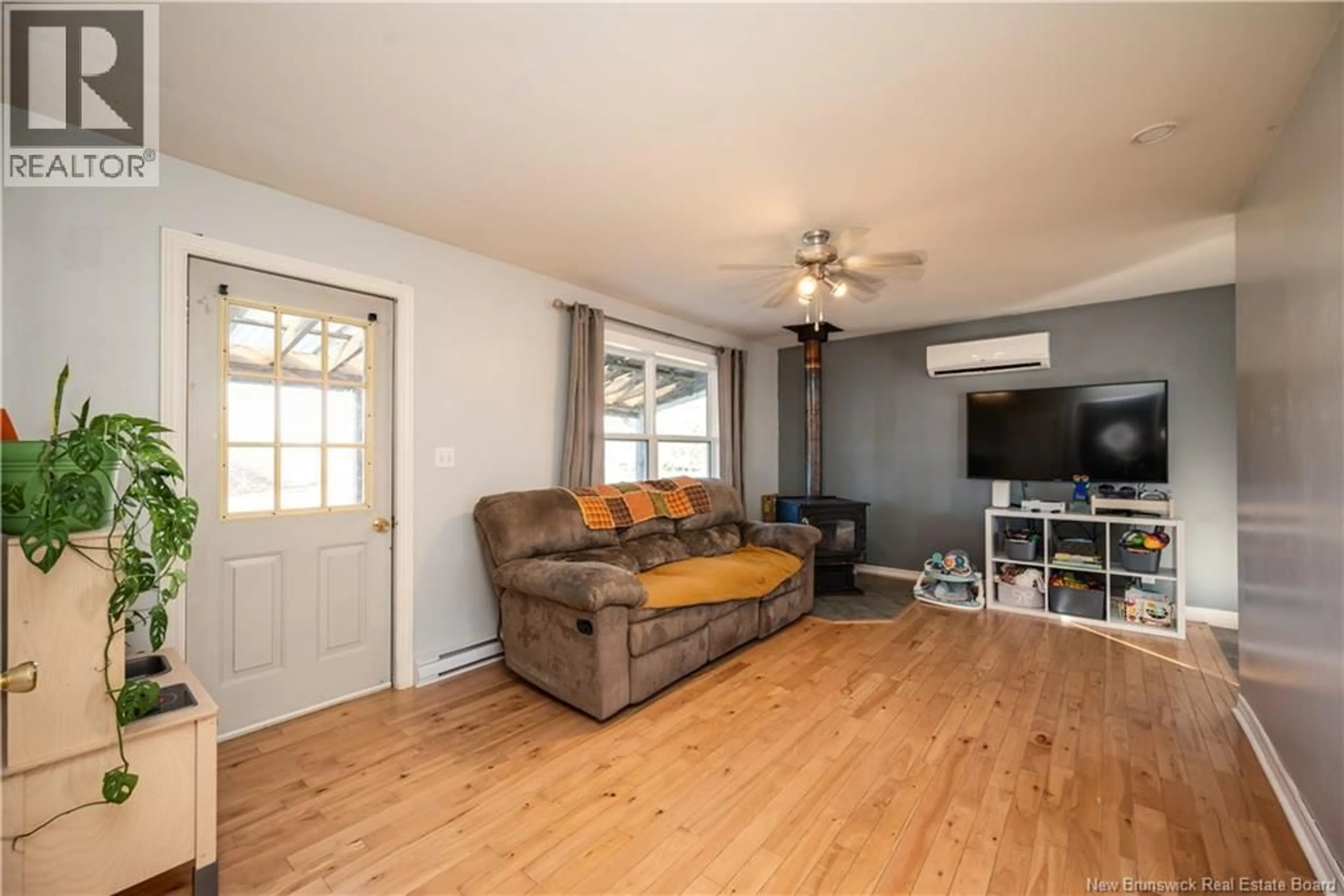 Living room with furniture, wood/laminate floor for 866 ROUTE 910, Turtle Creek New Brunswick E1J1X2