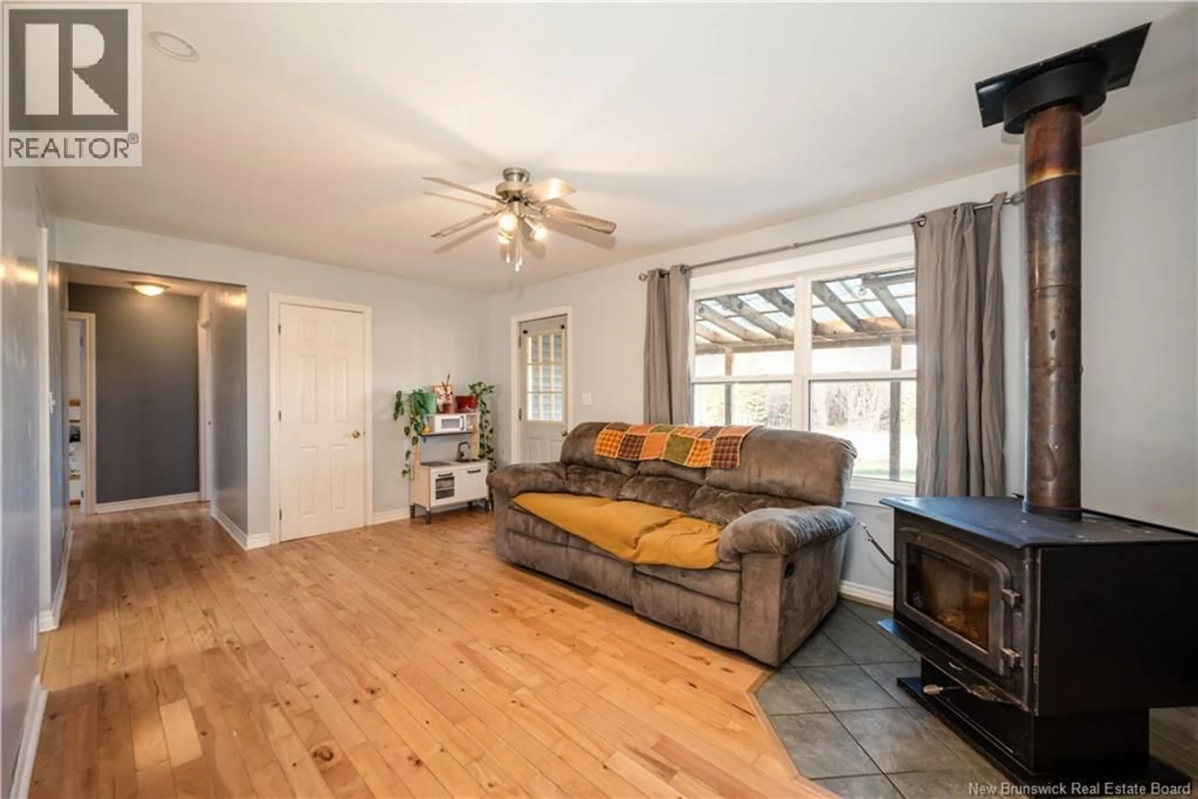 Living room with furniture, wood/laminate floor for 866 ROUTE 910, Turtle Creek New Brunswick E1J1X2