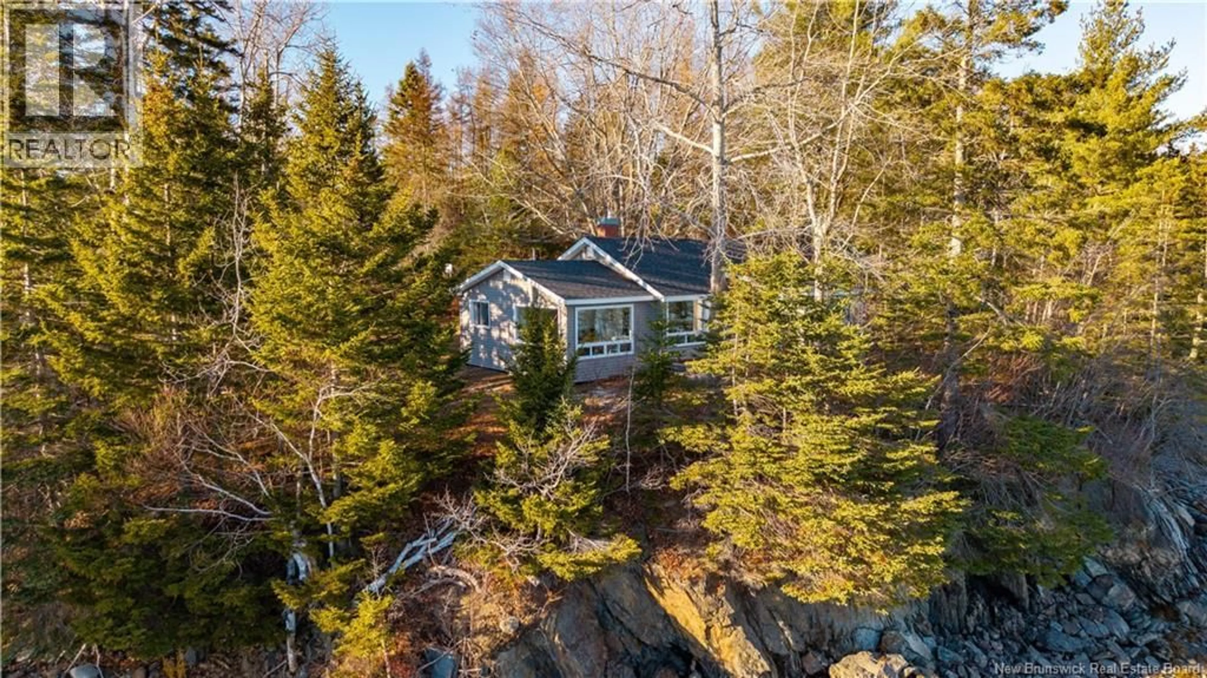 A pic from outside/outdoor area/front of a property/back of a property/a pic from drone, water/lake/river/ocean view for 11 COFFEY LANE, Oak Bay New Brunswick E3L3W2