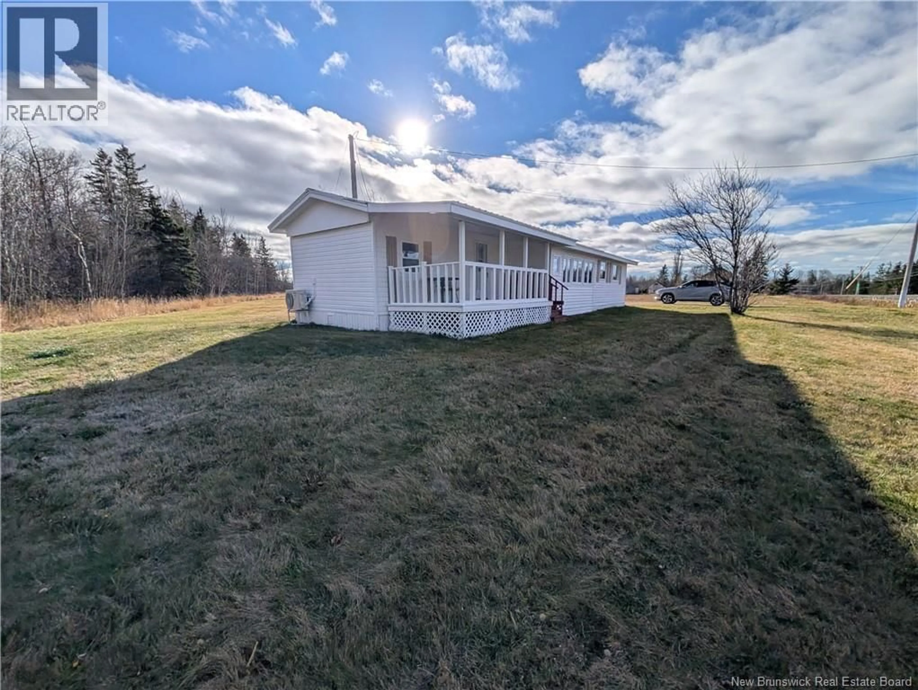 A pic from outside/outdoor area/front of a property/back of a property/a pic from drone, water/lake/river/ocean view for 5696 ROUTE 11, Janeville New Brunswick E2A5K2