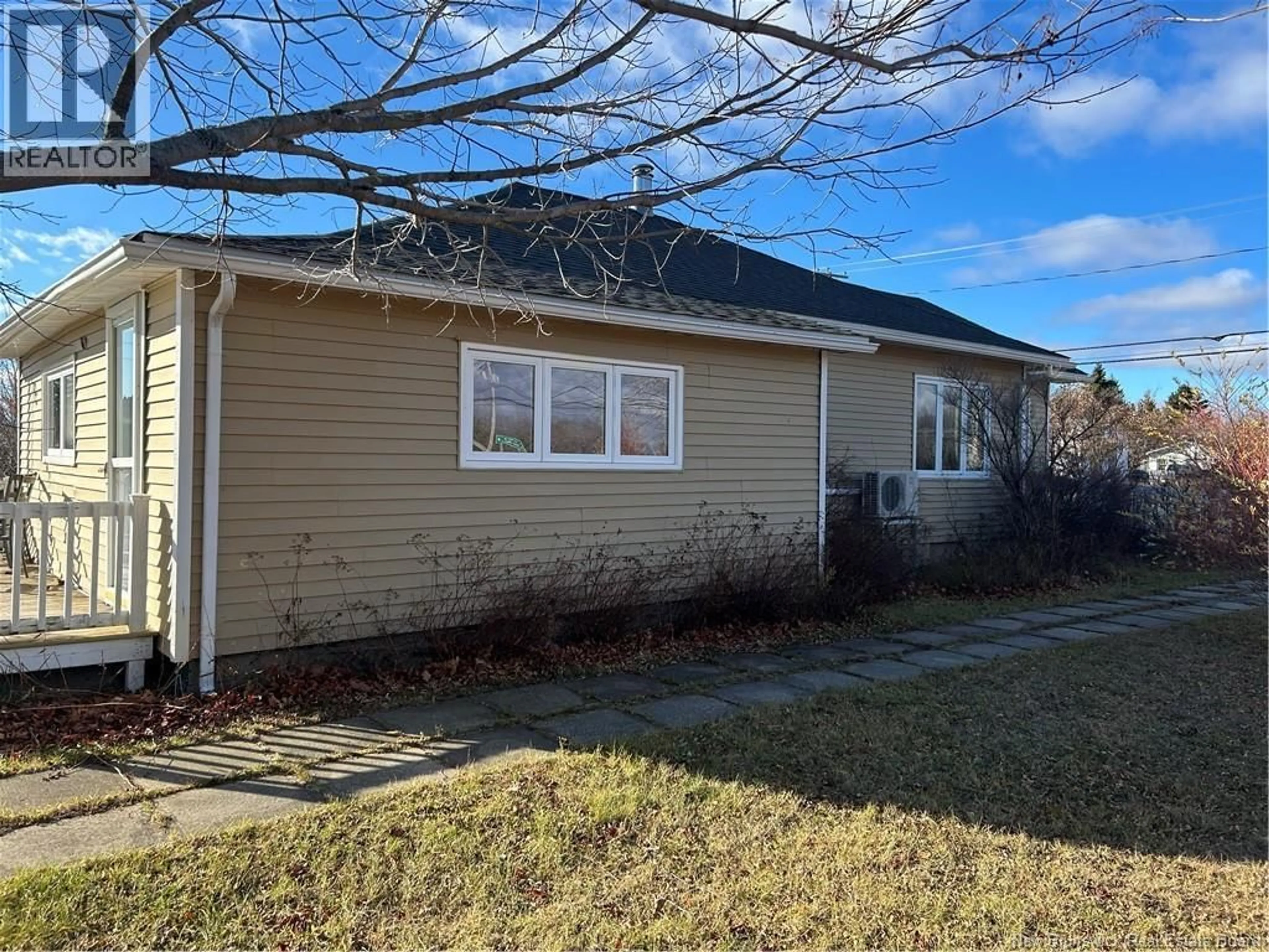 Home with vinyl exterior material, street for 10688 ROUTE 11, Six Roads New Brunswick E1X3C7