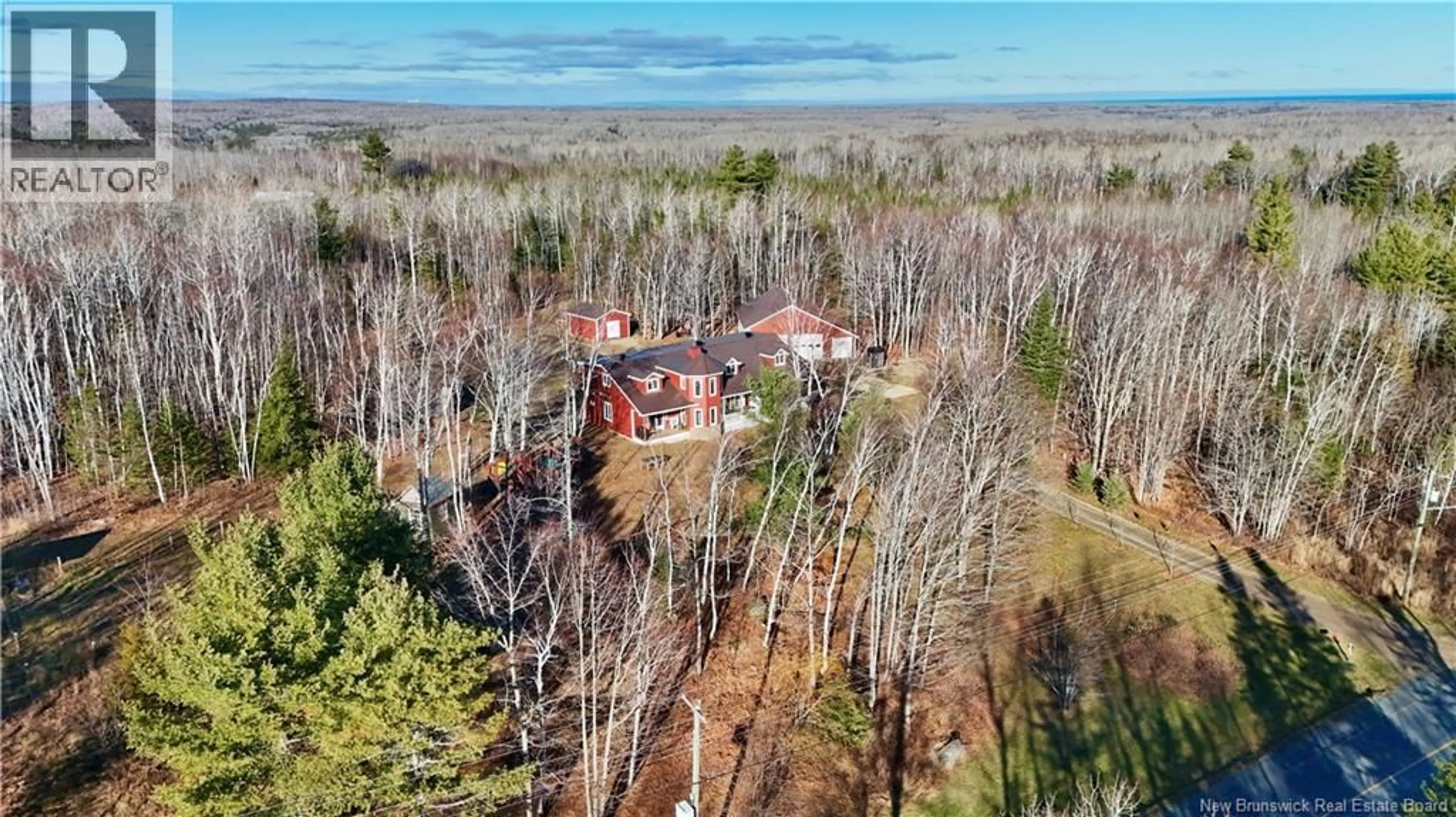 A pic from outside/outdoor area/front of a property/back of a property/a pic from drone, forest/trees view for 2790 SORMANY, Sormany New Brunswick E8K2Z3
