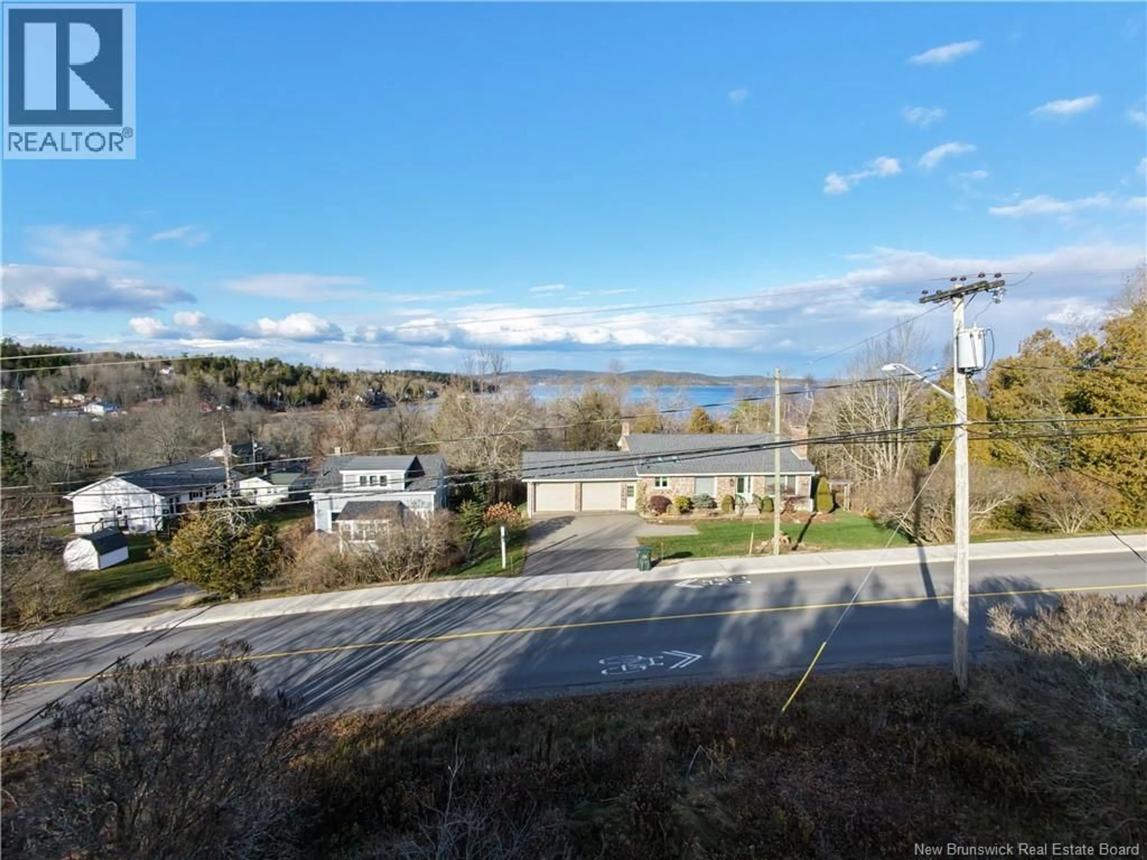 A pic from outside/outdoor area/front of a property/back of a property/a pic from drone, water/lake/river/ocean view for 2879 WESTFIELD ROAD, Saint John New Brunswick E2M6S6