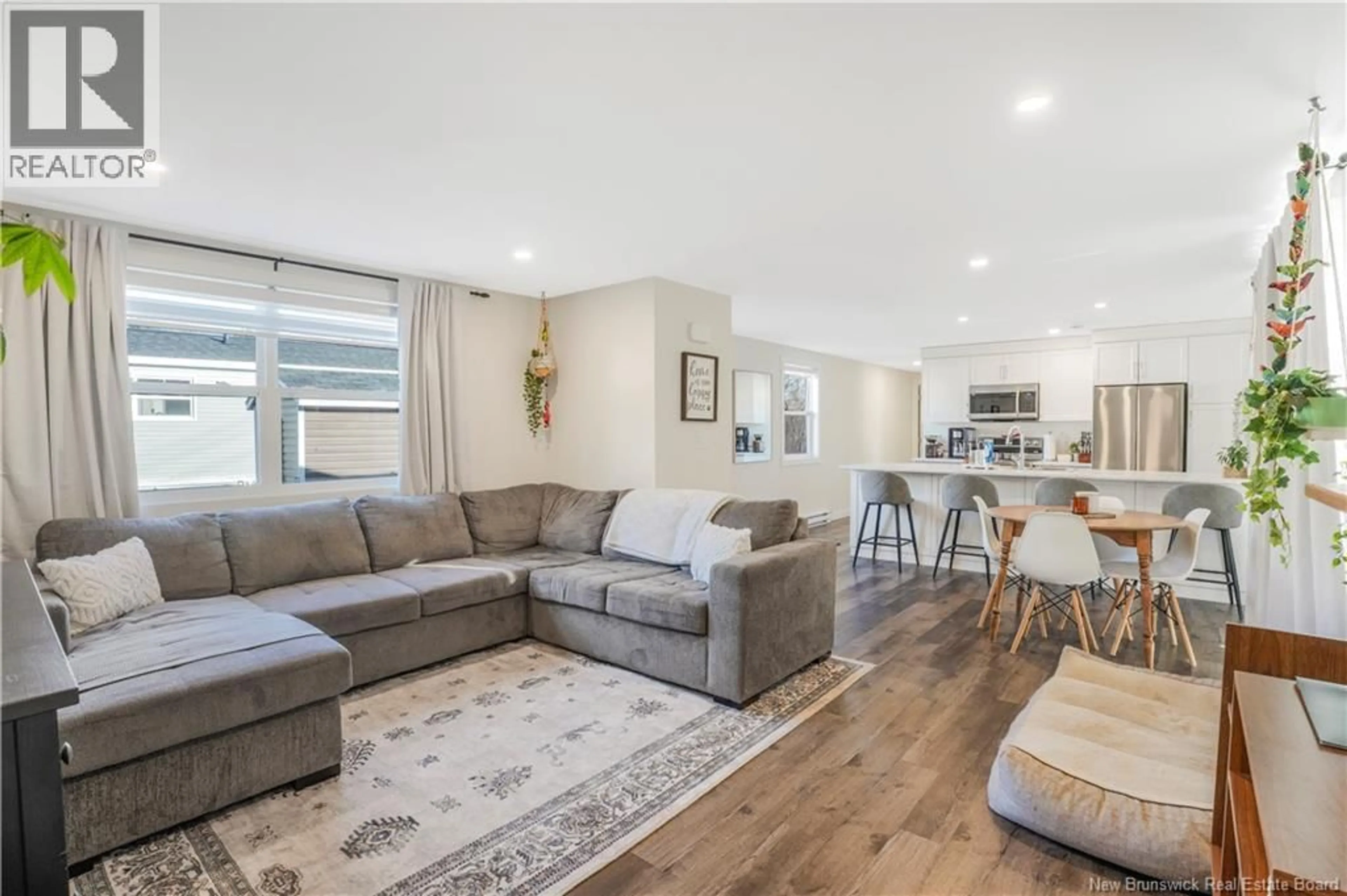 Living room with furniture, wood/laminate floor for 147 HEDGEVIEW DRIVE, Fredericton New Brunswick E3B6R9