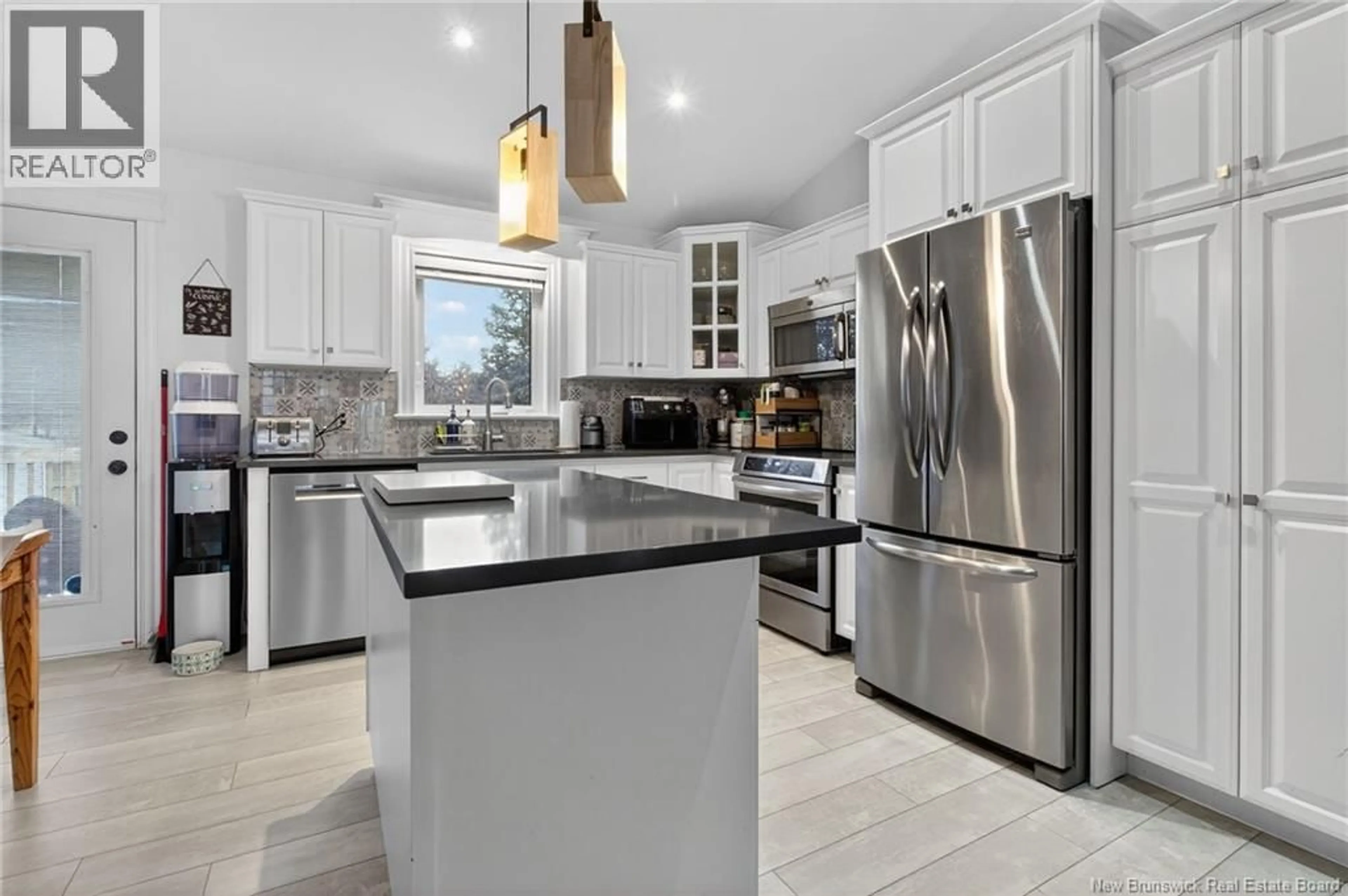 Open concept kitchen, ceramic/tile floor for 9 LAUZA AVENUE, Saint-Antoine New Brunswick E4V1J8