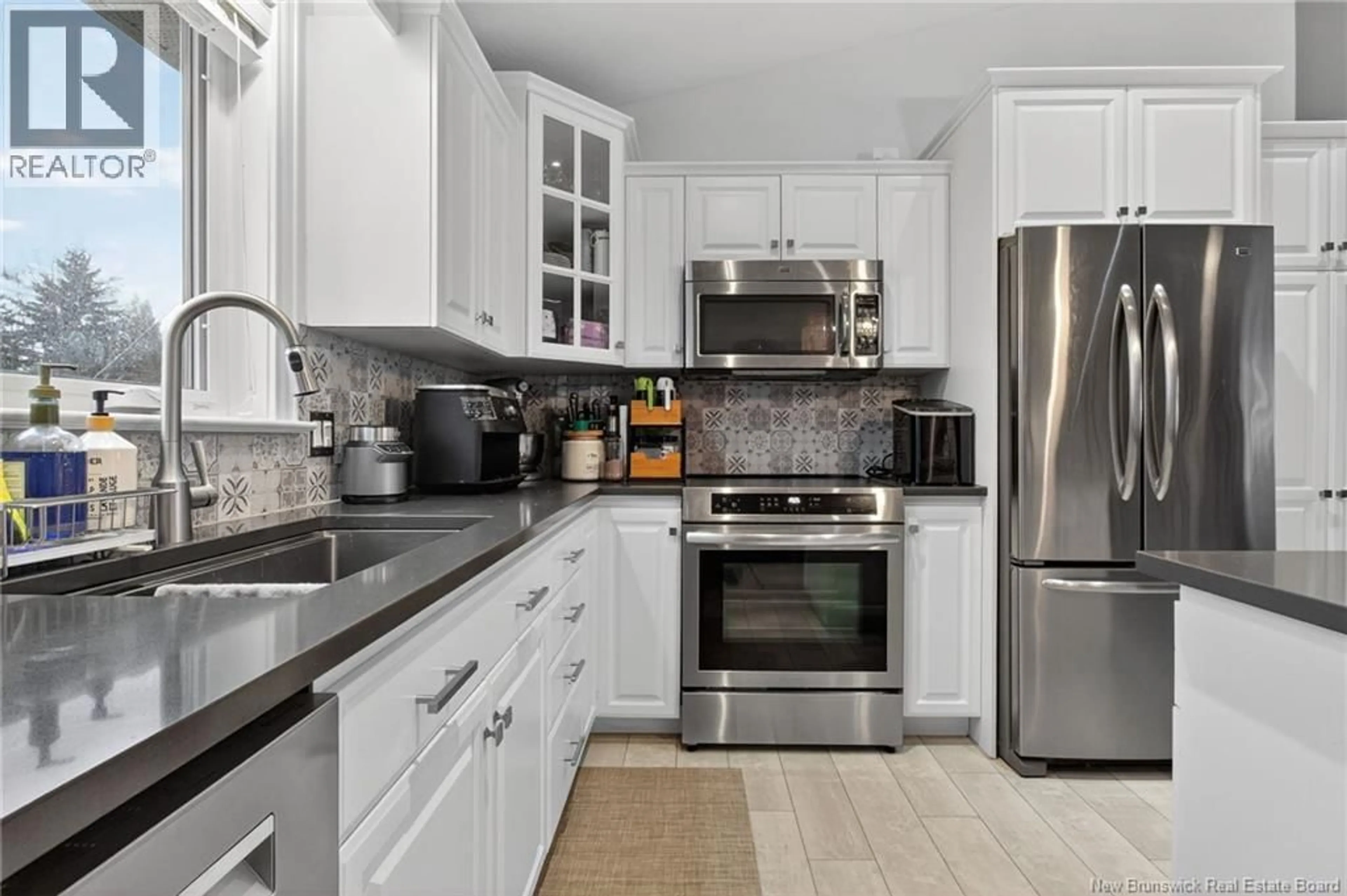 Open concept kitchen, ceramic/tile floor for 9 LAUZA AVENUE, Saint-Antoine New Brunswick E4V1J8