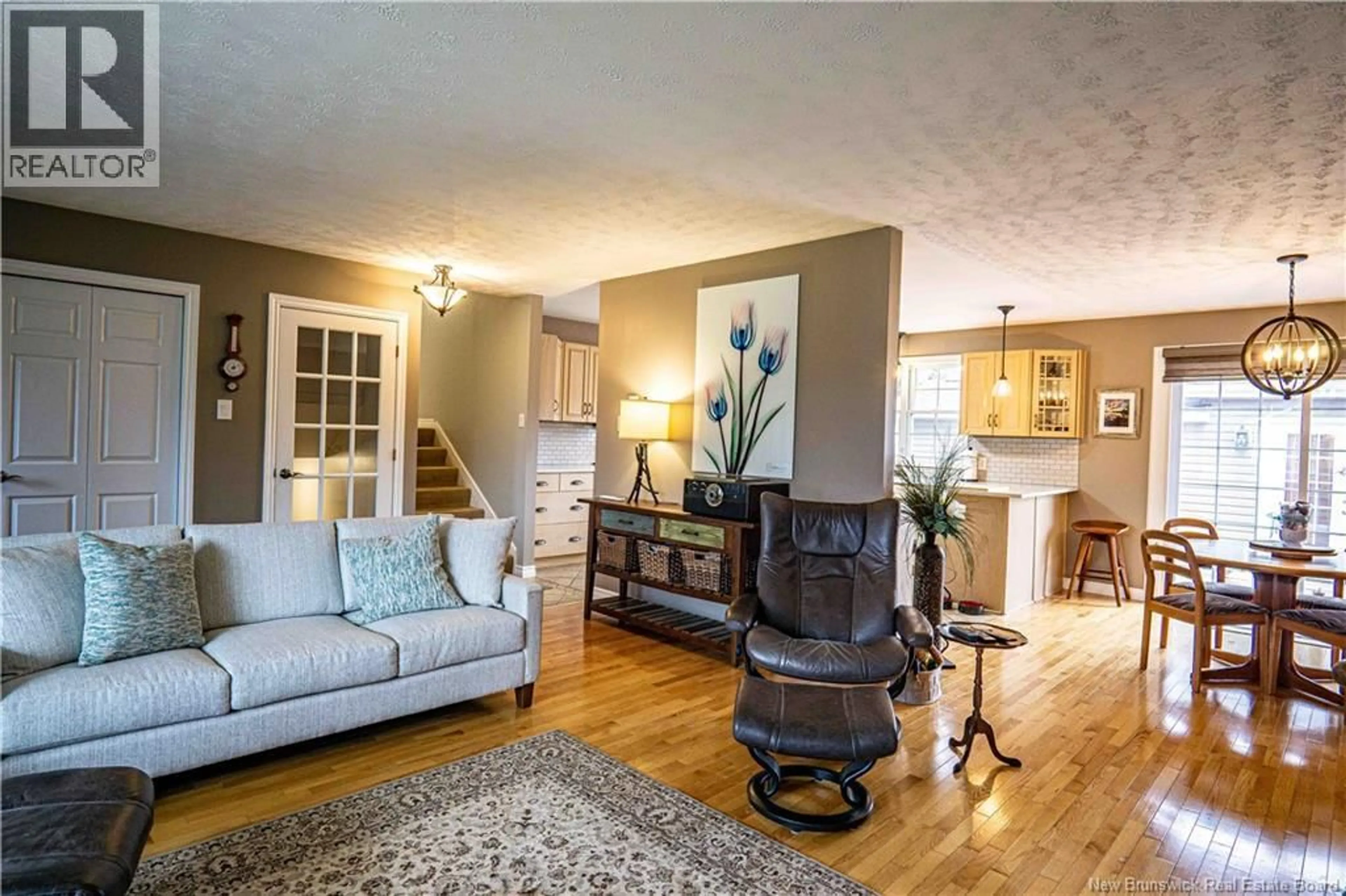 Living room with furniture, wood/laminate floor for 6 SPRUCEWOOD DRIVE, New Maryland New Brunswick E3C1C7