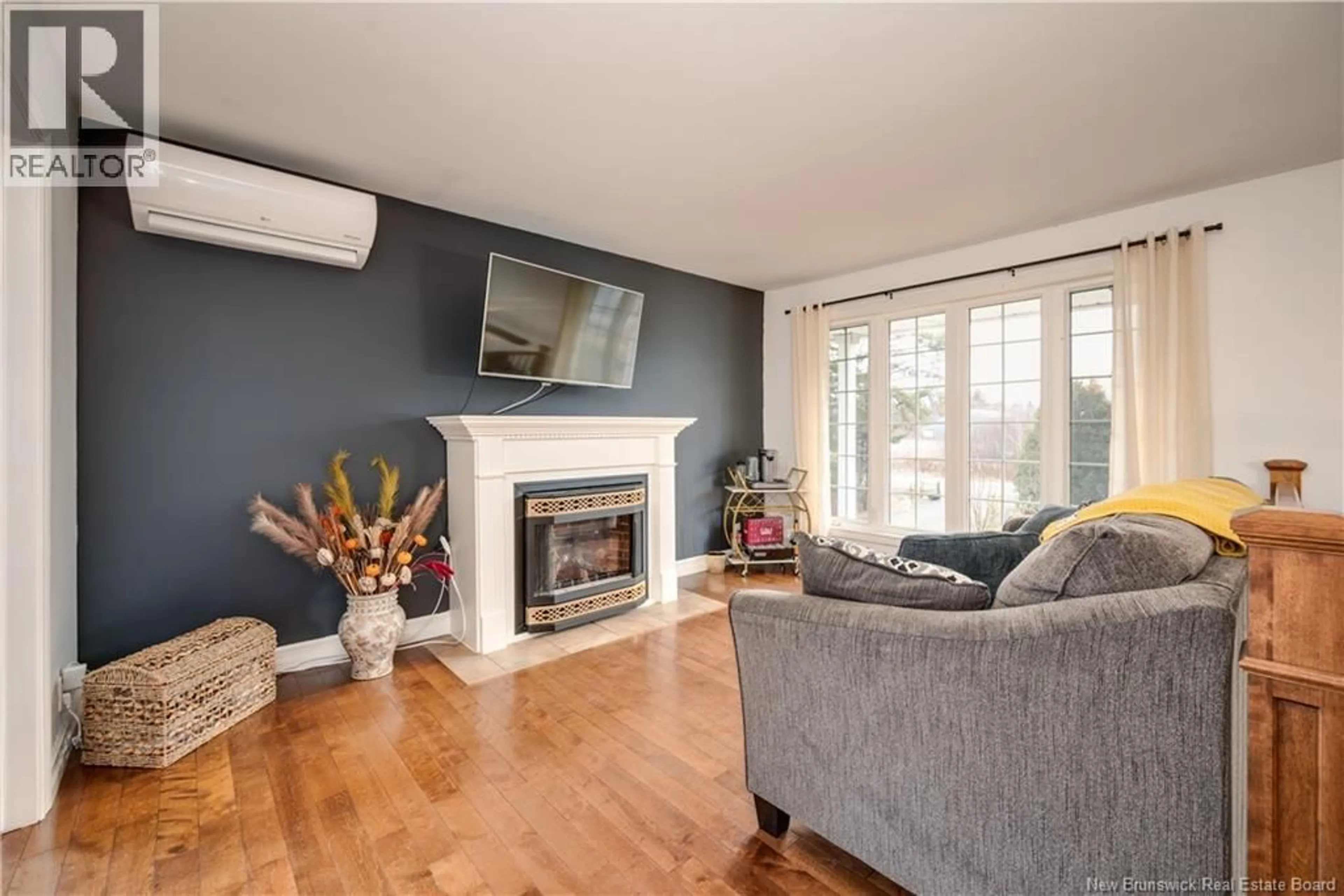 Living room with furniture, wood/laminate floor for 90 SAINT-PAUL STREET, Rogersville New Brunswick E4Y1W2