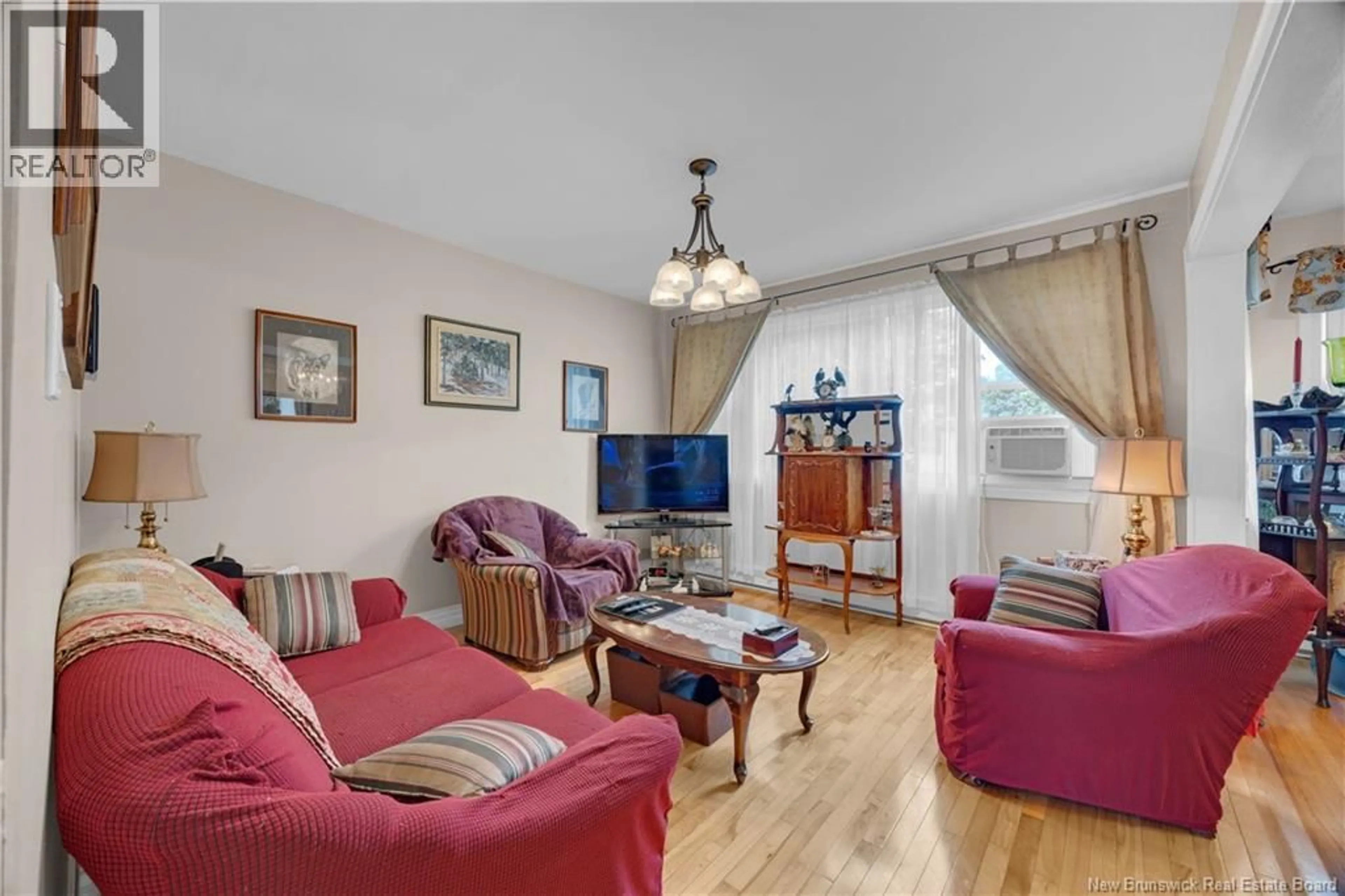 Living room with furniture, wood/laminate floor for 432 FUNDY DRIVE, Saint John New Brunswick E2M2R7